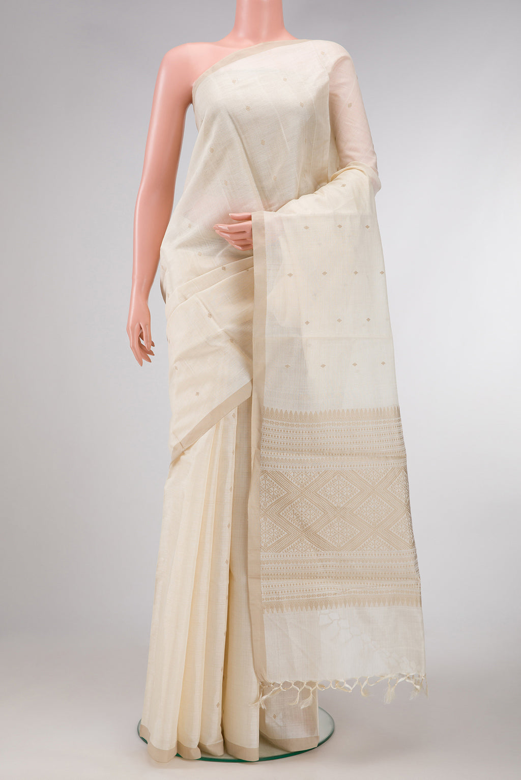 Sandal Dual Tone Tussar Silk Saree with Thread Butta on the body and Zari Border.  displayed on a mannequin