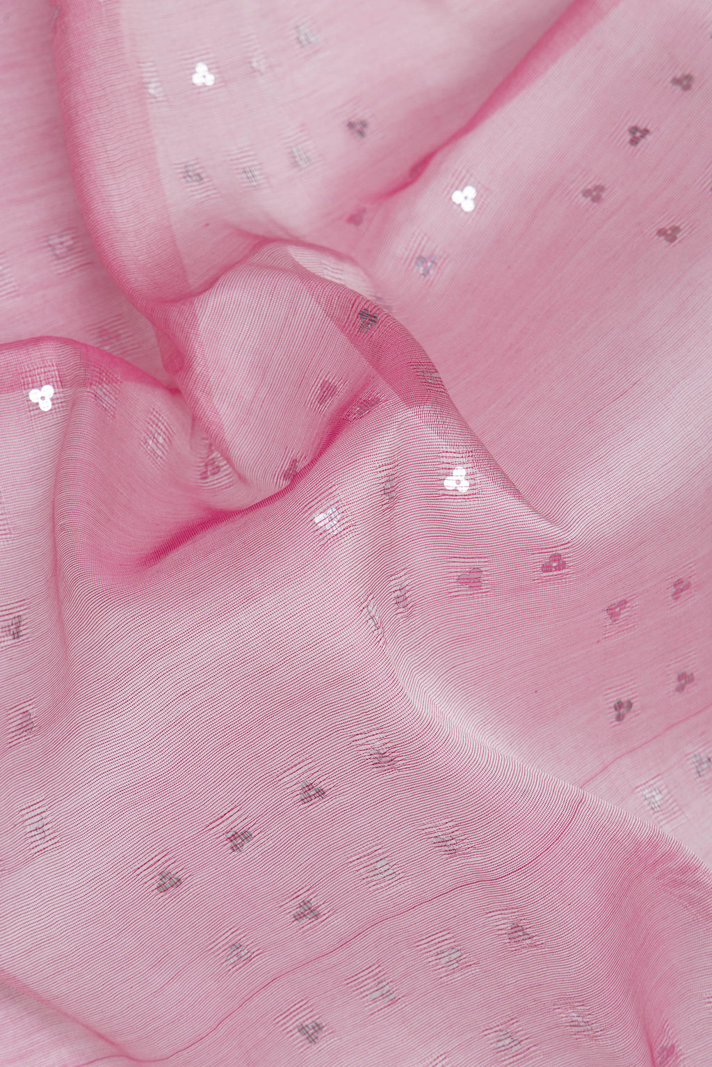 Close up of Pink Dual Tone Tussar Silk Saree with Embroidery on the body and Without Border.  displaying folds