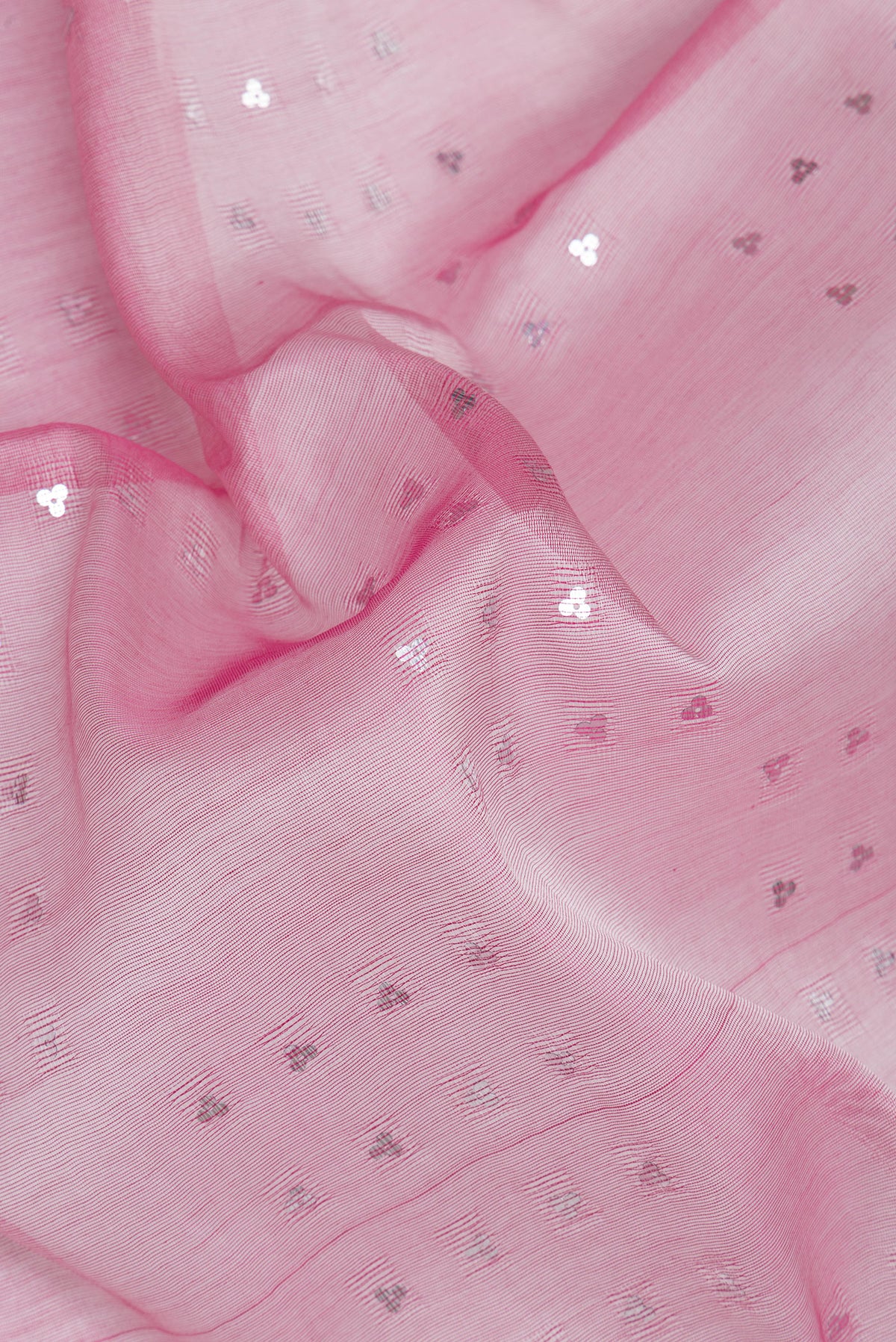 Close up of Pink Dual Tone Tussar Silk Saree with Embroidery on the body and Without Border.  displaying folds