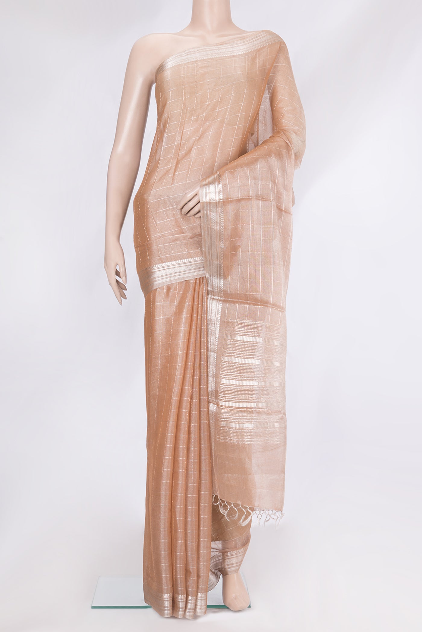Peach Dual Tone Tussar Silk Saree with Checked design on the body and Zari Border.  displayed on a mannequin