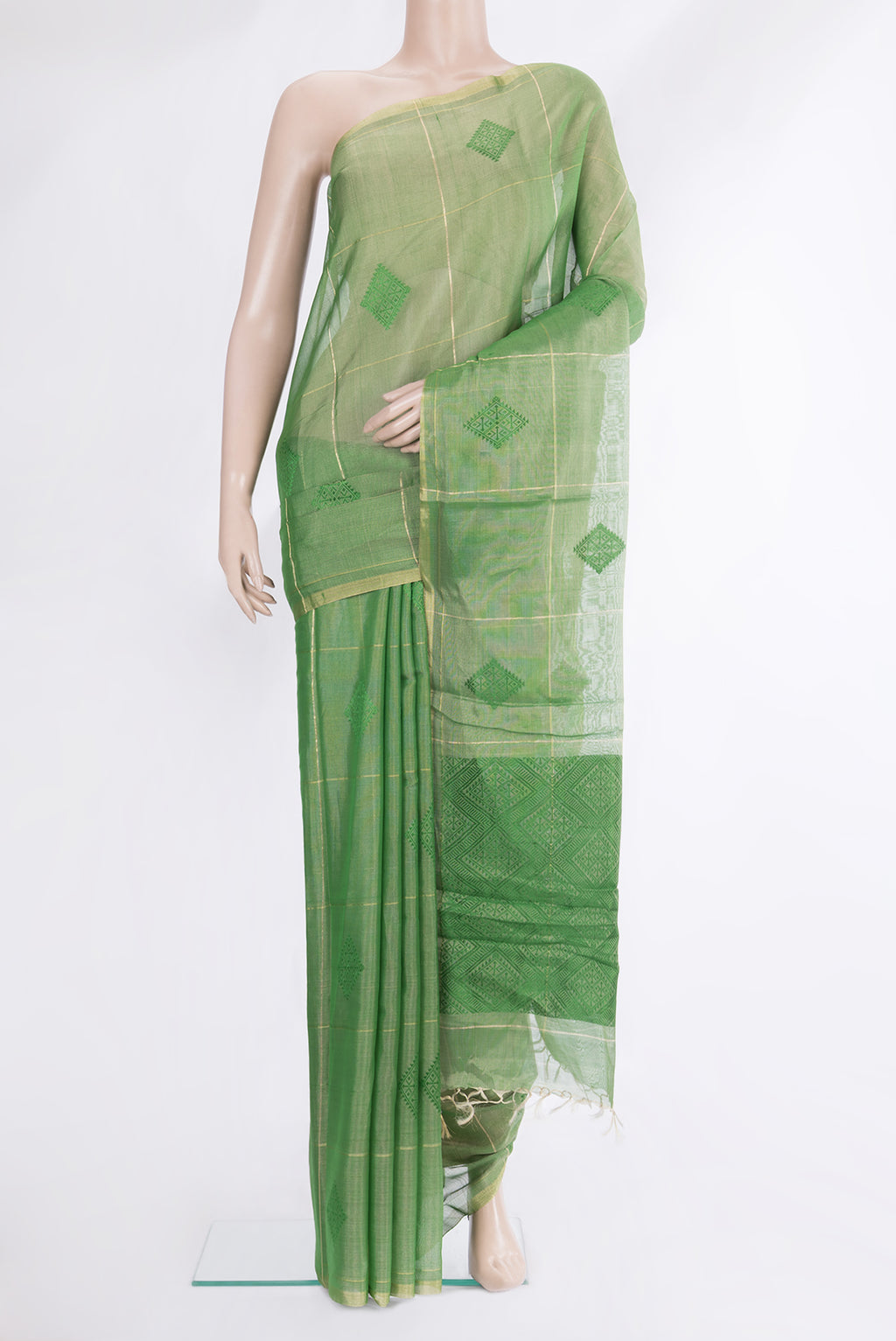 Green Tussar Saree with Checked design on the body and Zari Border.  displayed on a mannequin