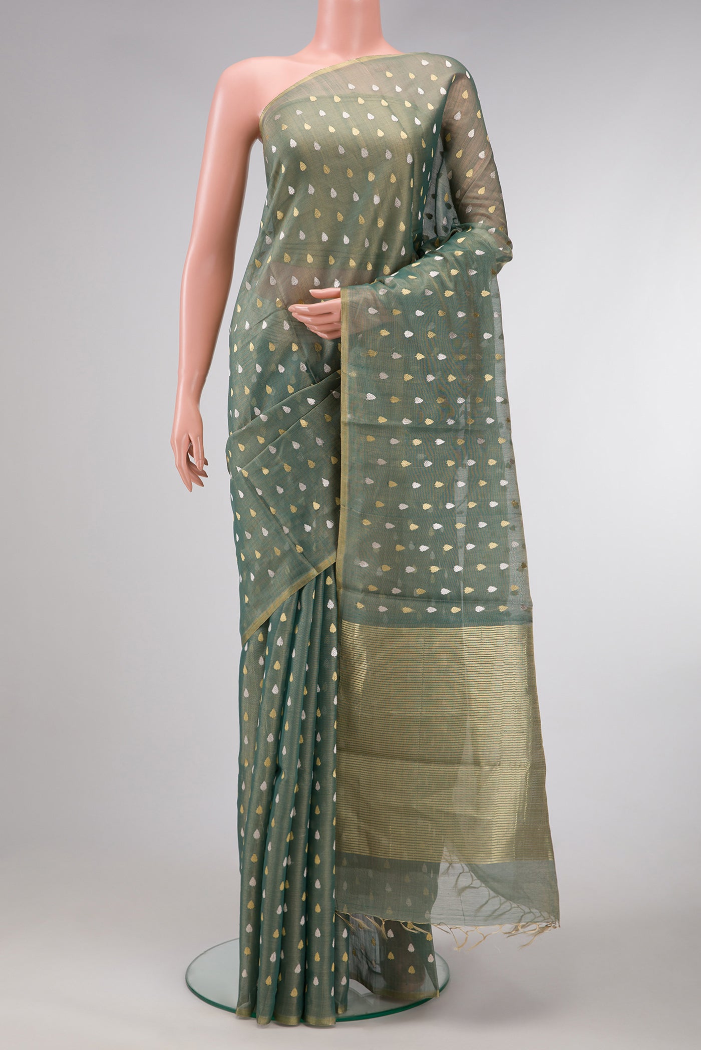 Green Dual Tone Chanderi Tissue Silk Saree with Zari Butta on the body and Zari Border.  displayed on a mannequin