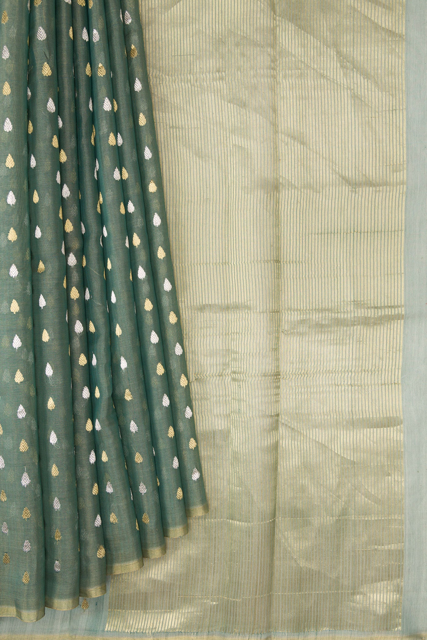 Pleats and pallu of Green Dual Tone Chanderi Tissue Silk Saree with Zari Butta on the body and Zari Border. 