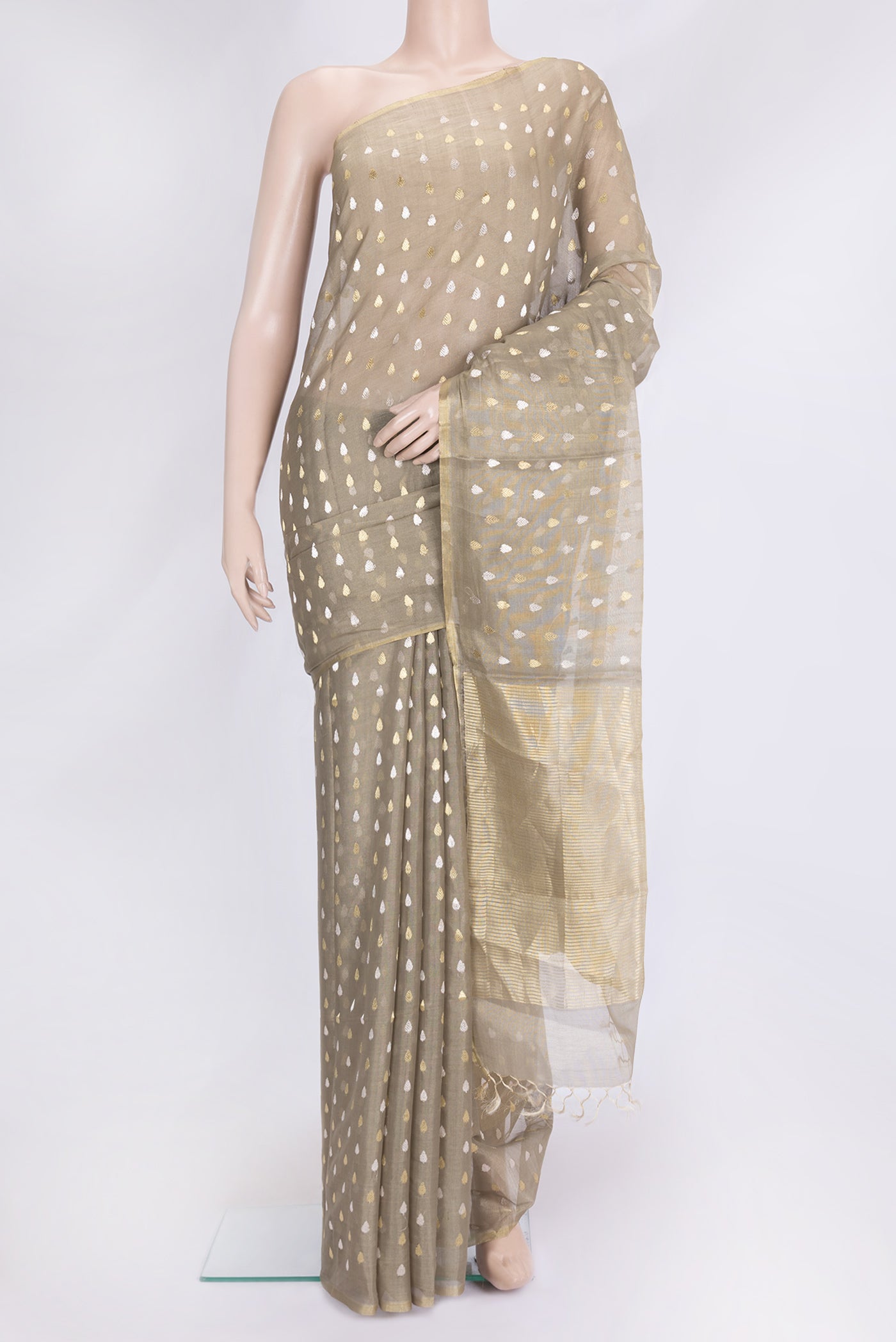 Mehandi Green Dual Tone Tussar Silk Saree with Zari Butta on the body and Thin Zari Line.  displayed on a mannequin