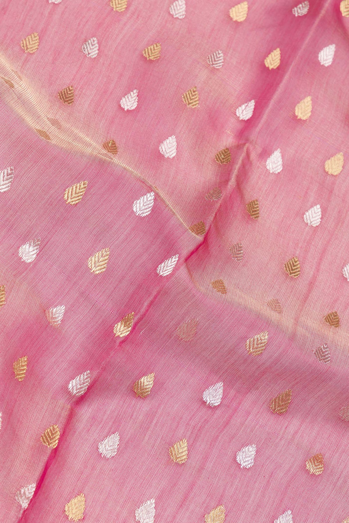 Close up of Rose pink Dual Tone Tussar Silk Saree with Zari Butta on the body and Zari Border.  displaying folds