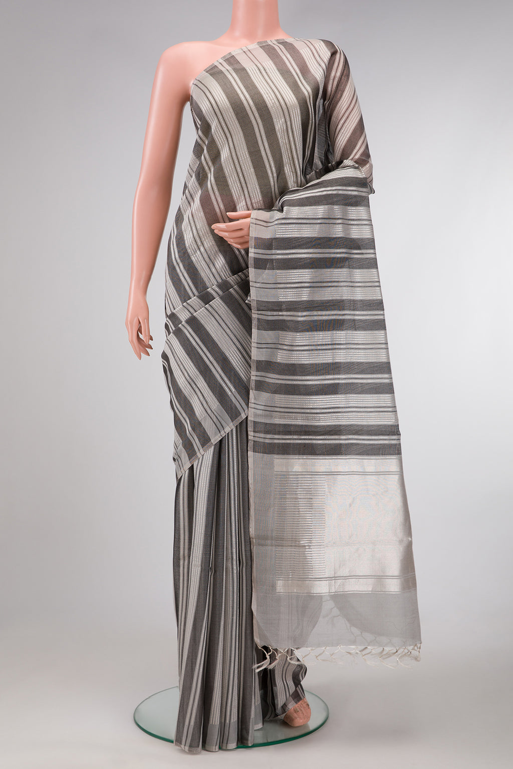 Grey Dual Tone Tussar Silk Saree with Stripes on the body and Without Border.  displayed on a mannequin