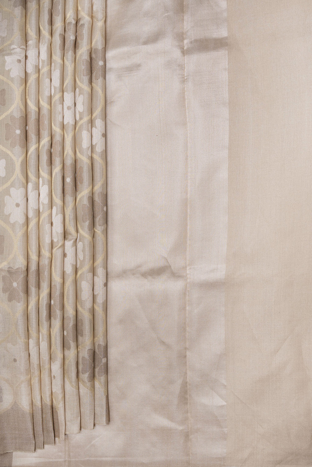 Pleats and pallu of Beige Dual Tone Chanderi Silk Saree with Zari Brocade on the body and Without Border. 