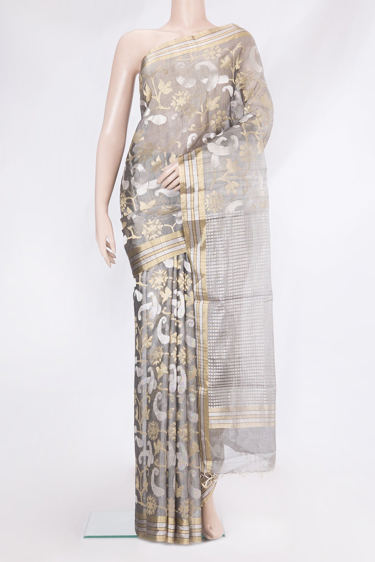 Grey Tussar Silk Saree with Zari Brocade on the body and Zari Border.  displayed on a mannequin