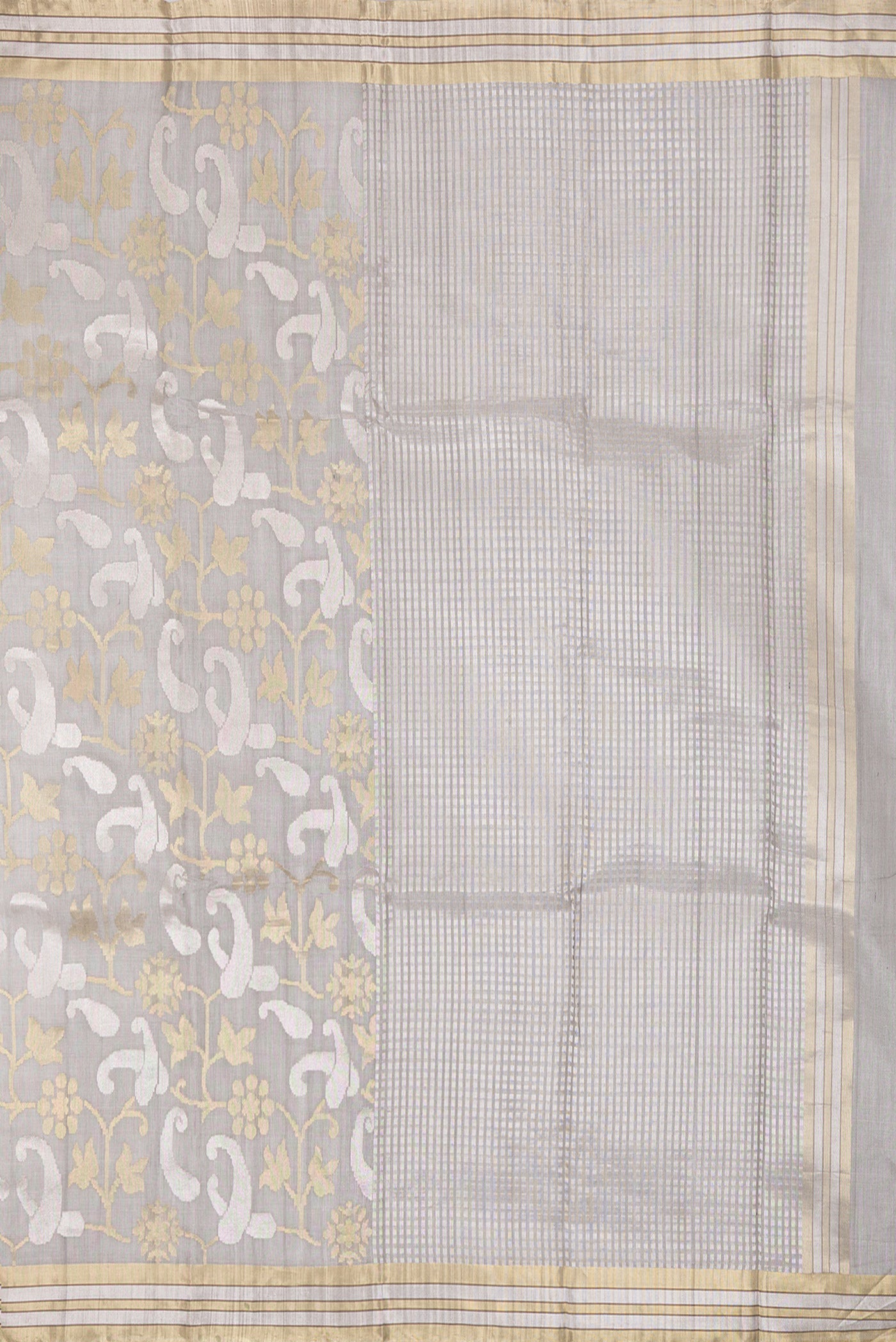 Close up image of the pallu of Grey Tussar Silk Saree with Zari Brocade on the body and Zari Border. 