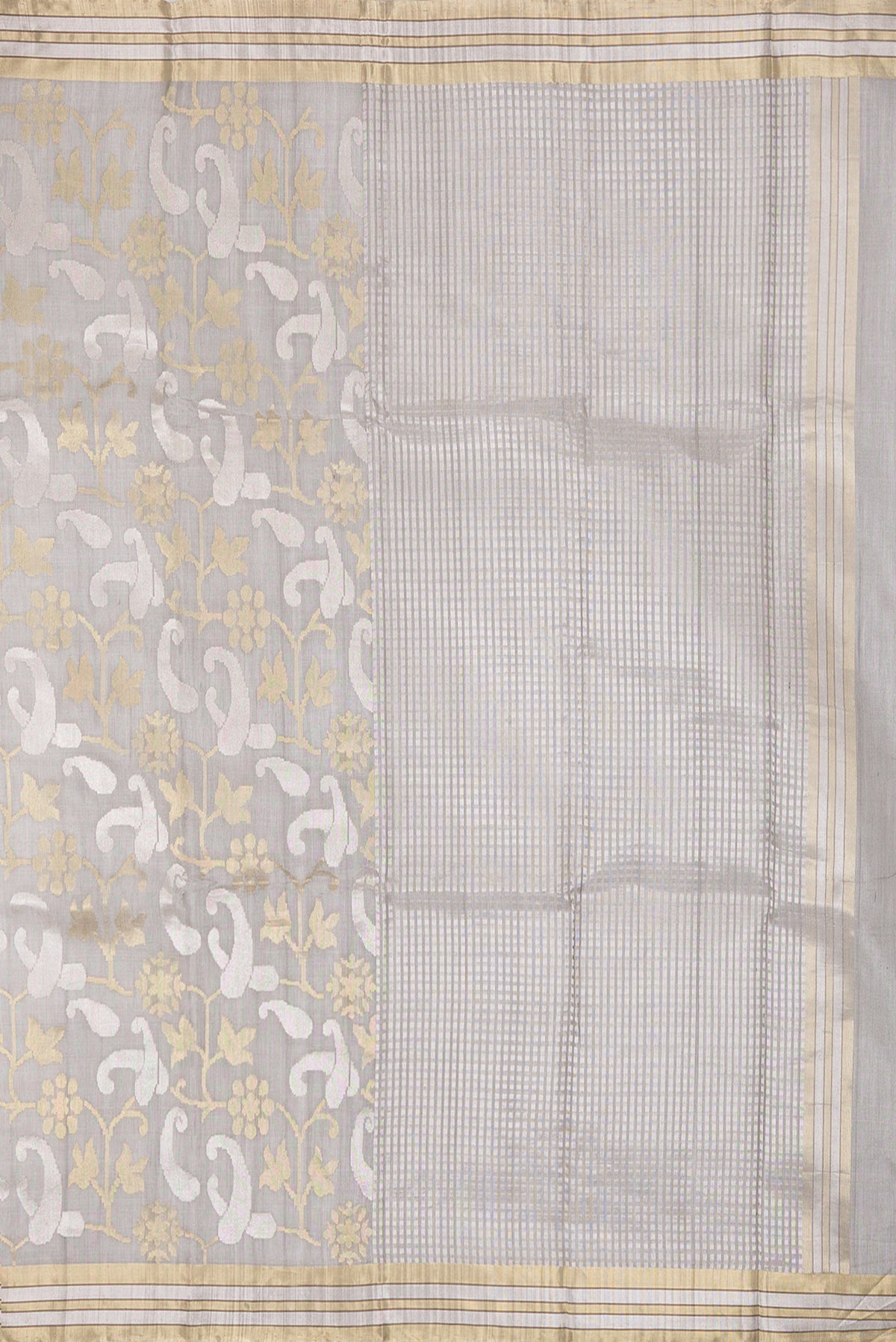Close up image of the pallu of Grey Tussar Silk Saree with Zari Brocade on the body and Zari Border. 