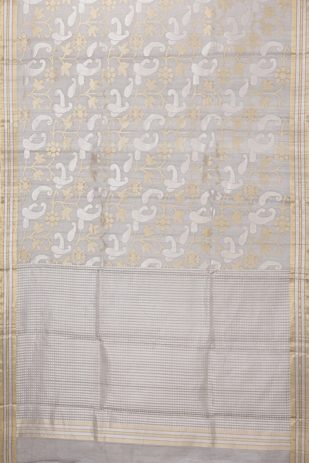 Flat view of Grey Tussar Silk Saree with Zari Brocade on the body and Zari Border. 