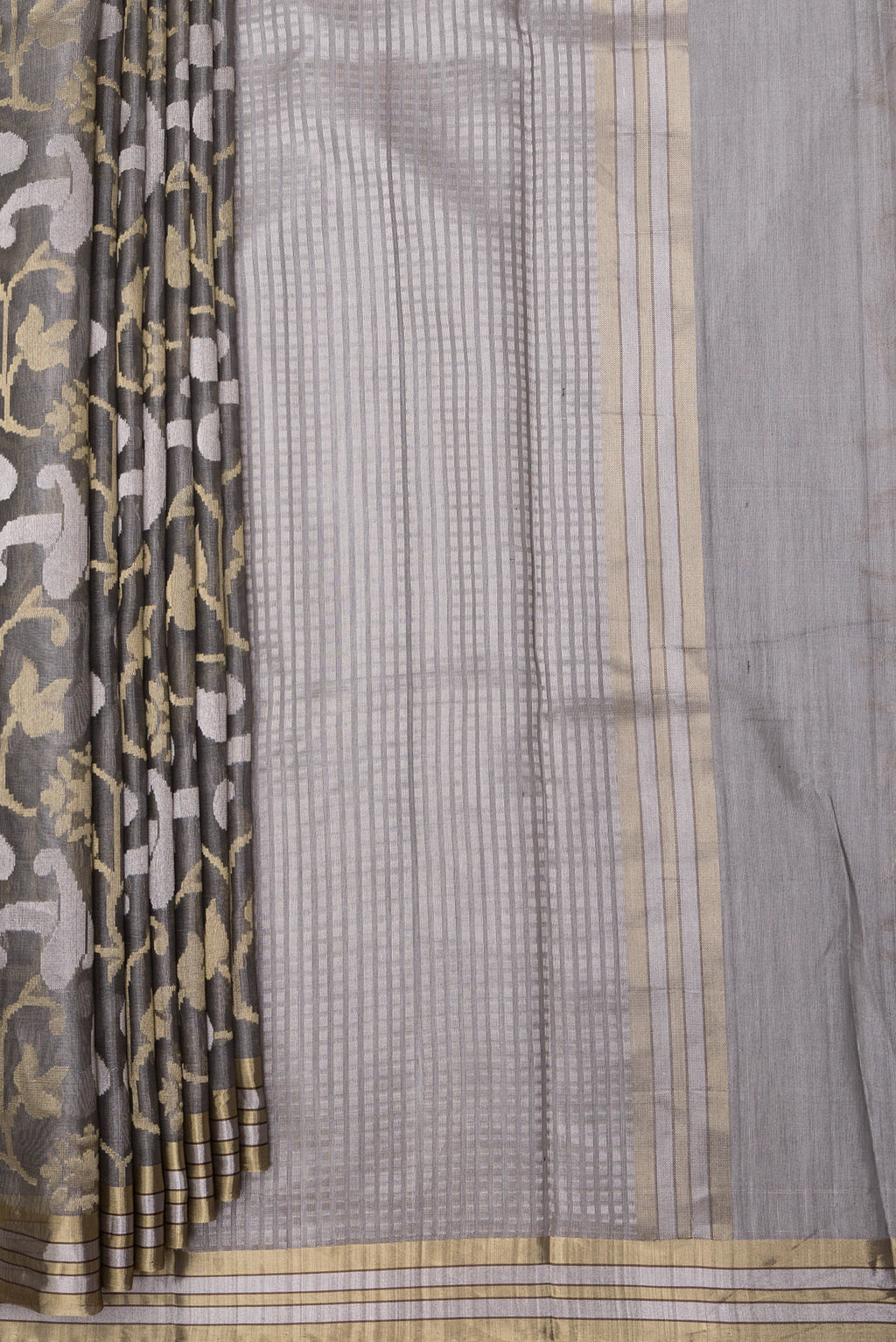 Pleats and pallu of Grey Tussar Silk Saree with Zari Brocade on the body and Zari Border. 