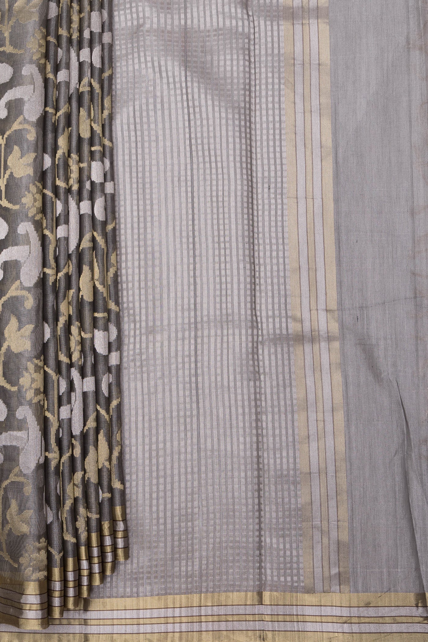 Pleats and pallu of Grey Tussar Silk Saree with Zari Brocade on the body and Zari Border. 