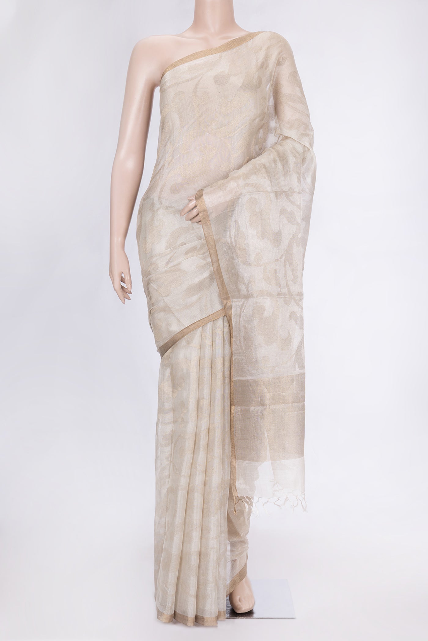 Beige Dual Tone Chanderi Silk Saree with Zari Brocade on the body and Zari Border.  displayed on a mannequin