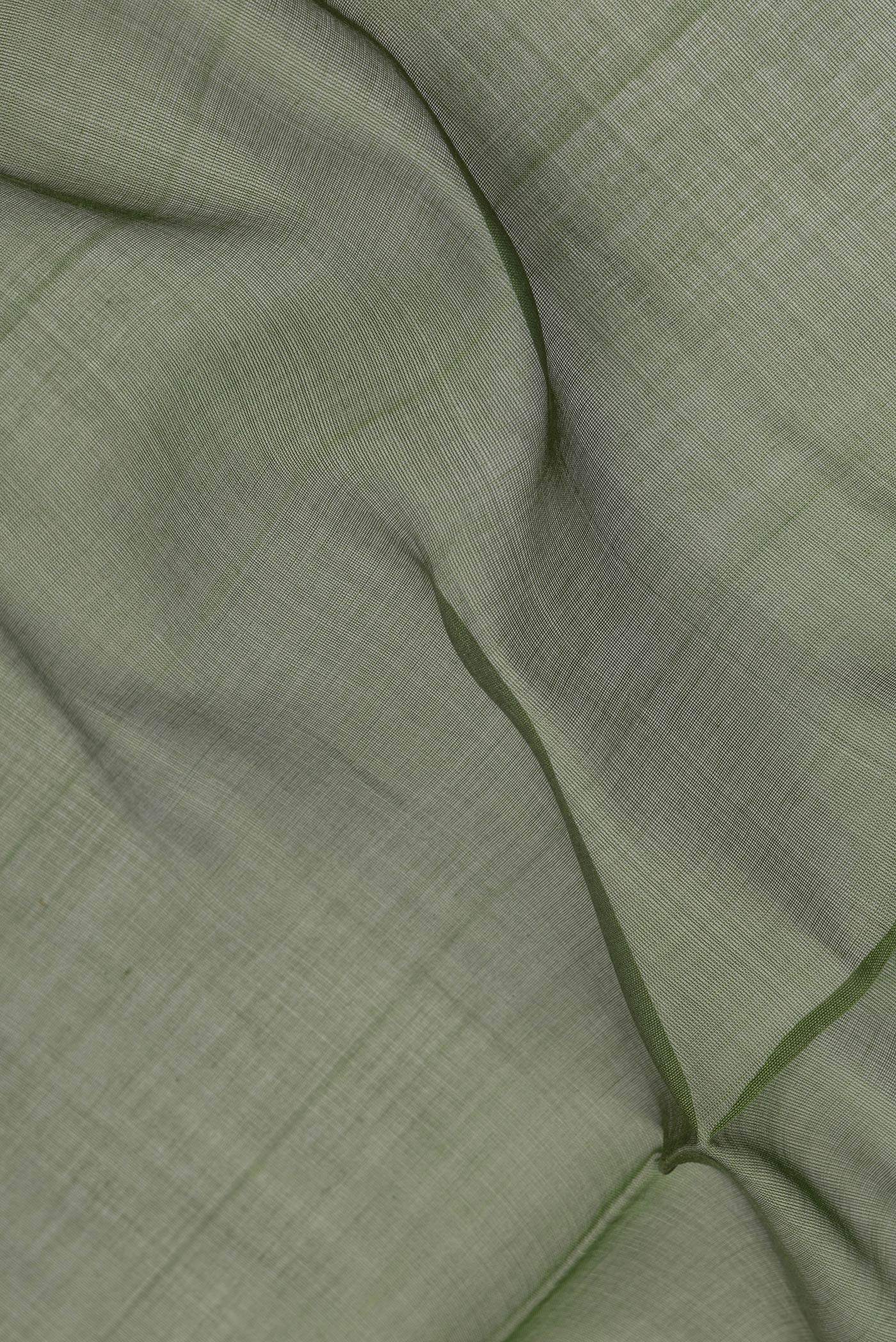 Close up of Green Dual Tone Tussar Silk Saree with Checked design on the body and Zari Border.  displaying folds