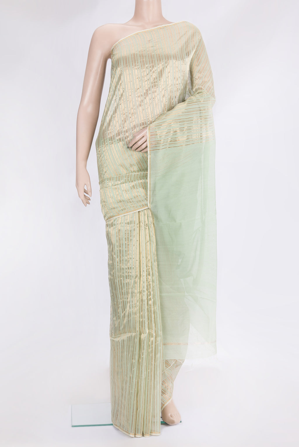 Pista Green Tussar Silk Saree with Stripes on the body and Thin Zari Line.  displayed on a mannequin