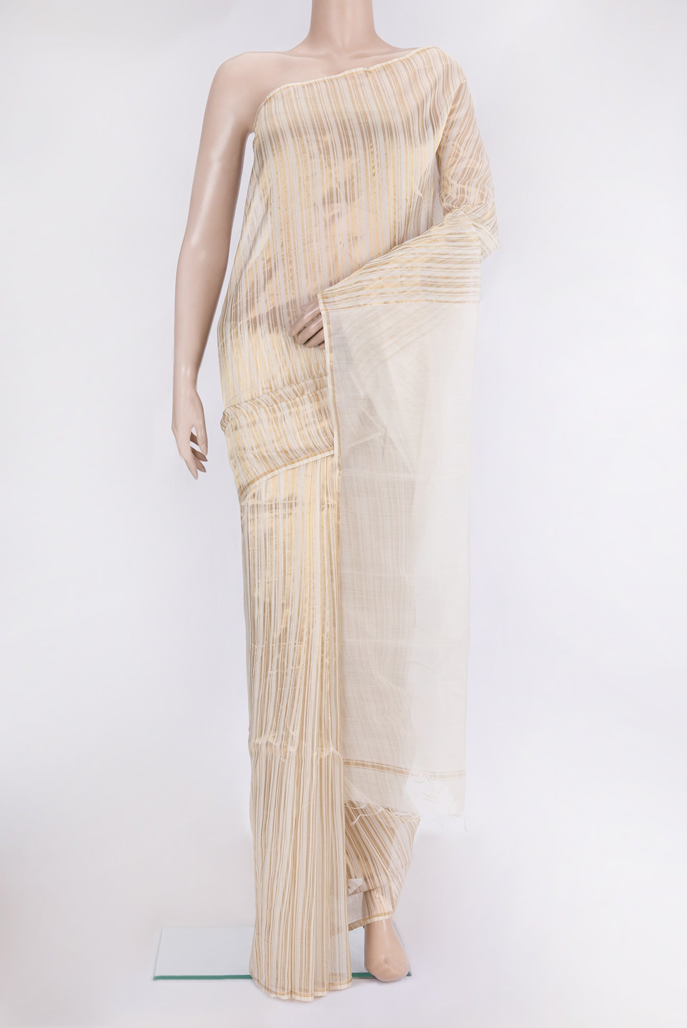 Off White Tussar Silk Saree with Stripes on the body and Thin Zari Line.  displayed on a mannequin