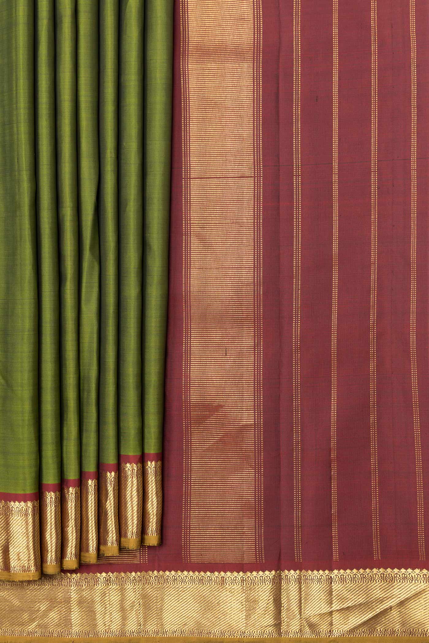 Pleats and pallu of Mehandi Green Dual Tone Kanchipuram Saree with Plain Body and Zari Border. 