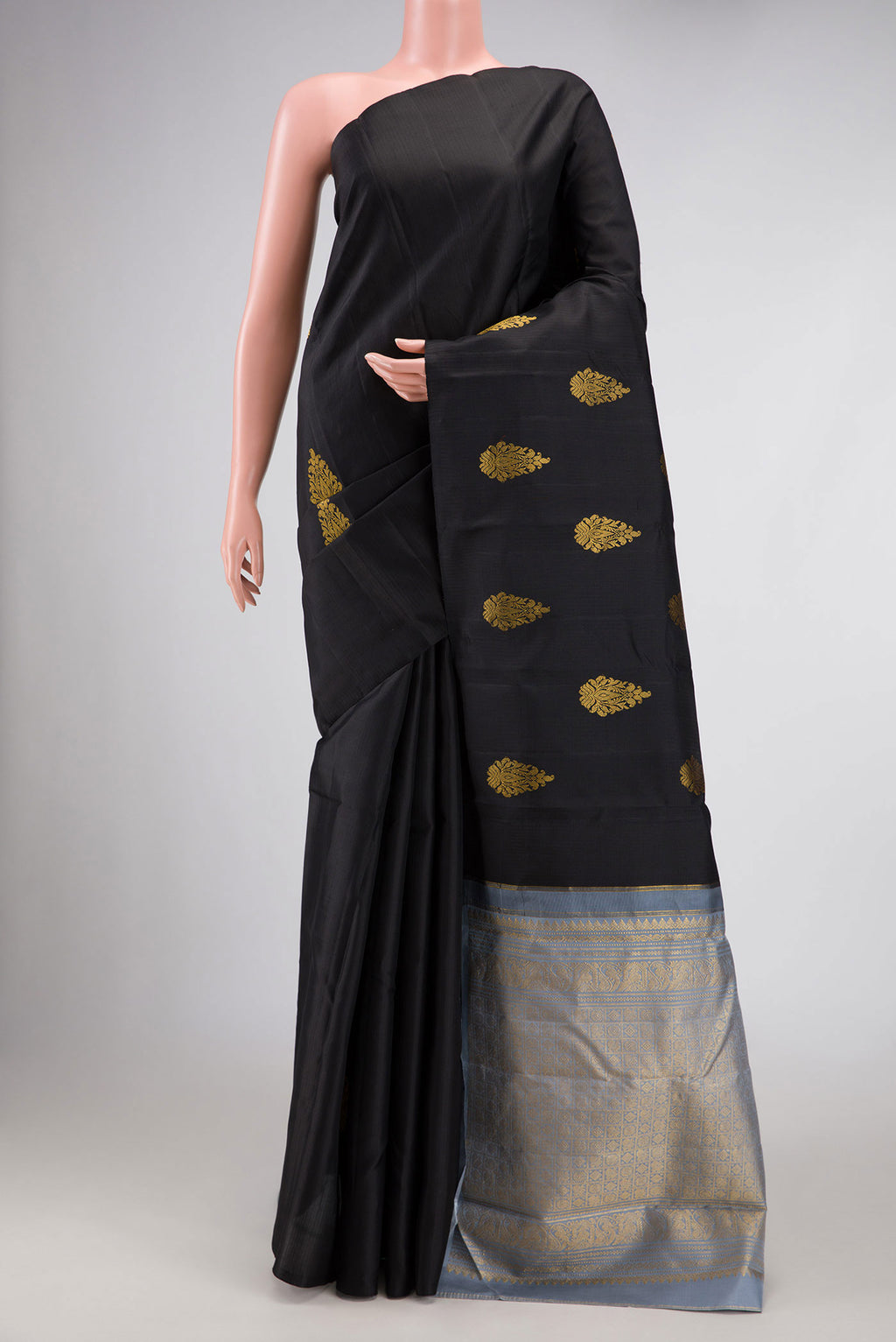 Black Dual Tone Kanchipuram Silk Saree with Zari Butta on the body and Without Border displayed on a mannequin