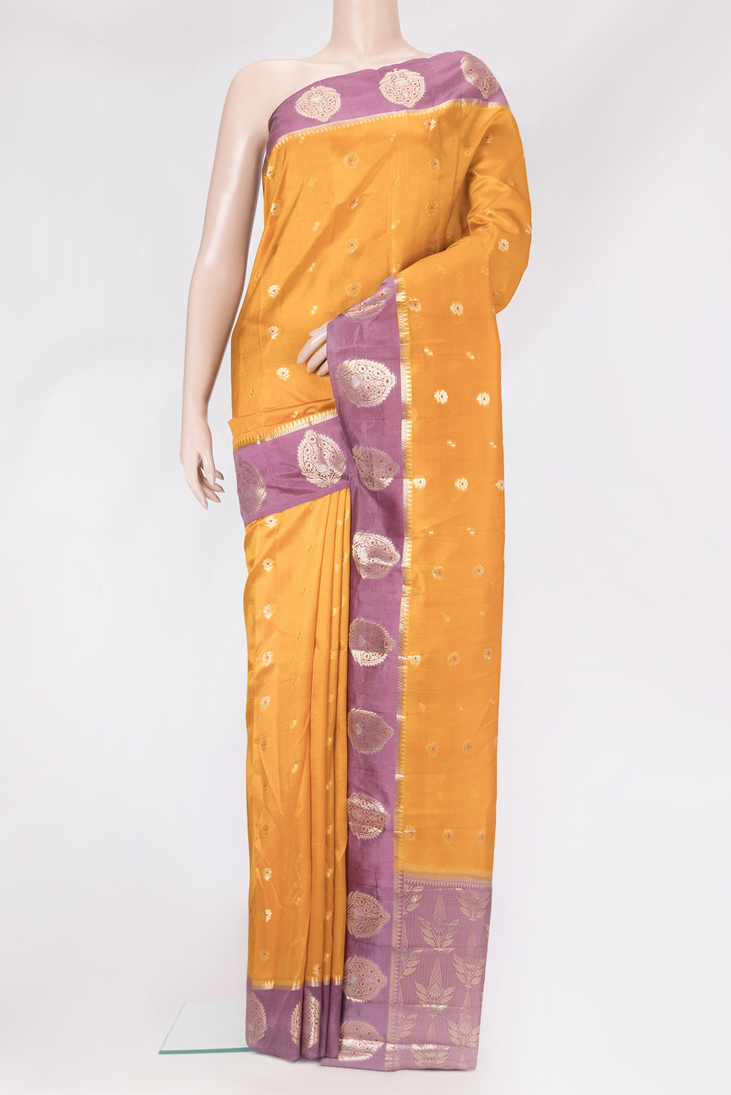 Mustard Dual Tone Tussar Silk Saree with Zari Butta on the body and Fancy Border.  displayed on a mannequin