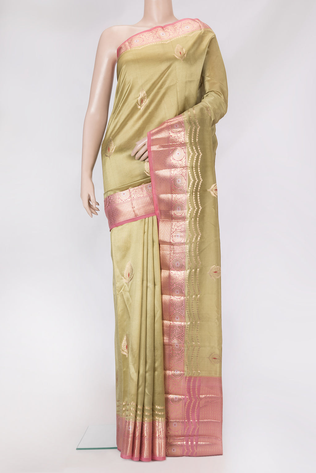 Beige Dual Tone Tussar Silk Saree with Zari Butta on the body and Zari Border.  displayed on a mannequin