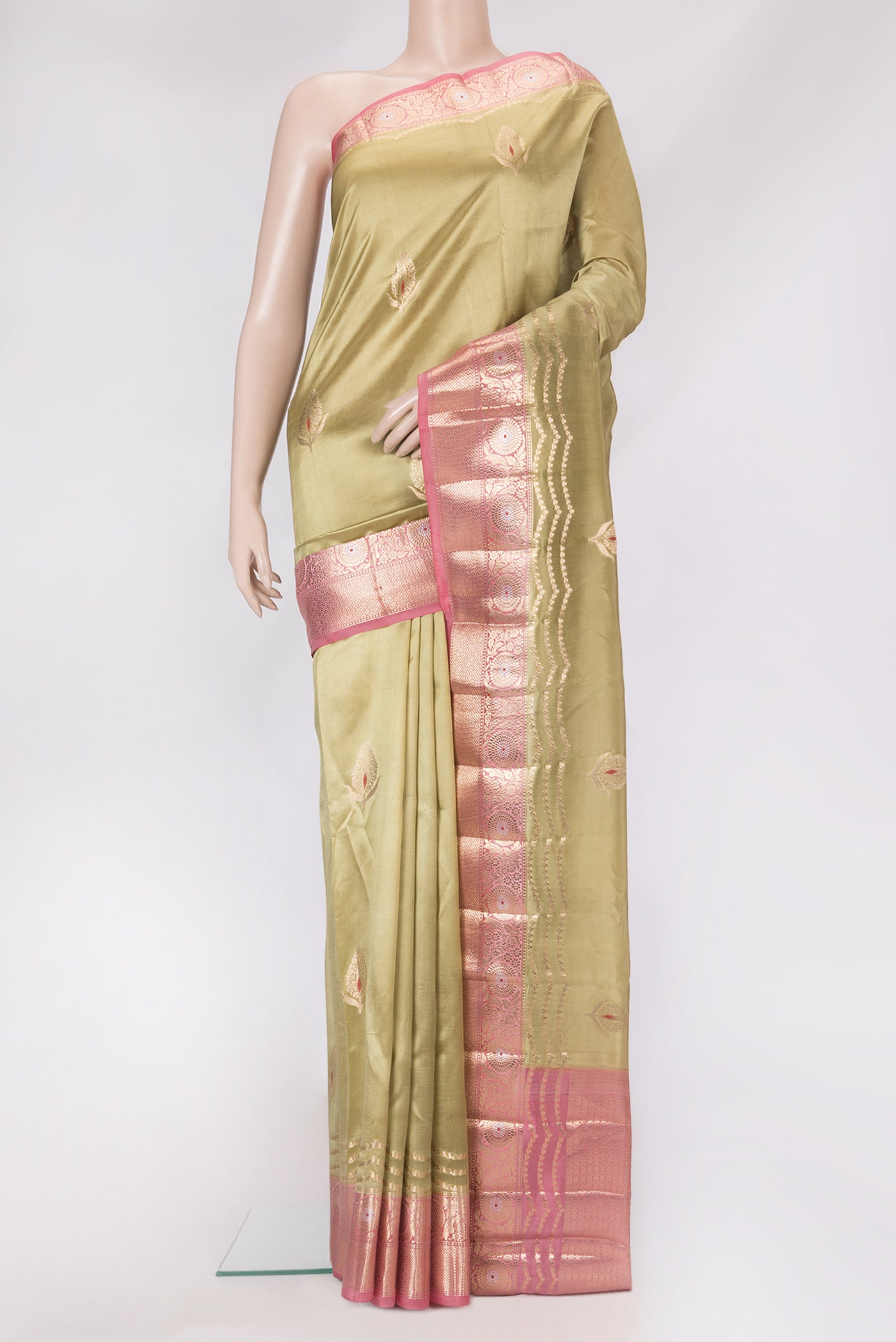 Beige Dual Tone Tussar Silk Saree with Zari Butta on the body and Zari Border.  displayed on a mannequin