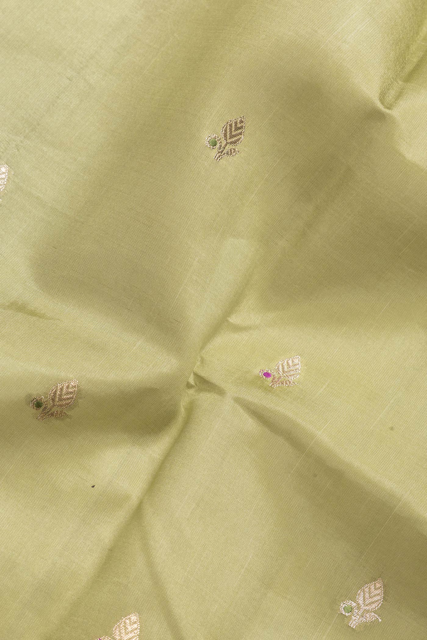 Close up of Mehandi Green Dual Tone Tussar Silk Saree with Zari Butta on the body and Fancy Border.  displaying folds