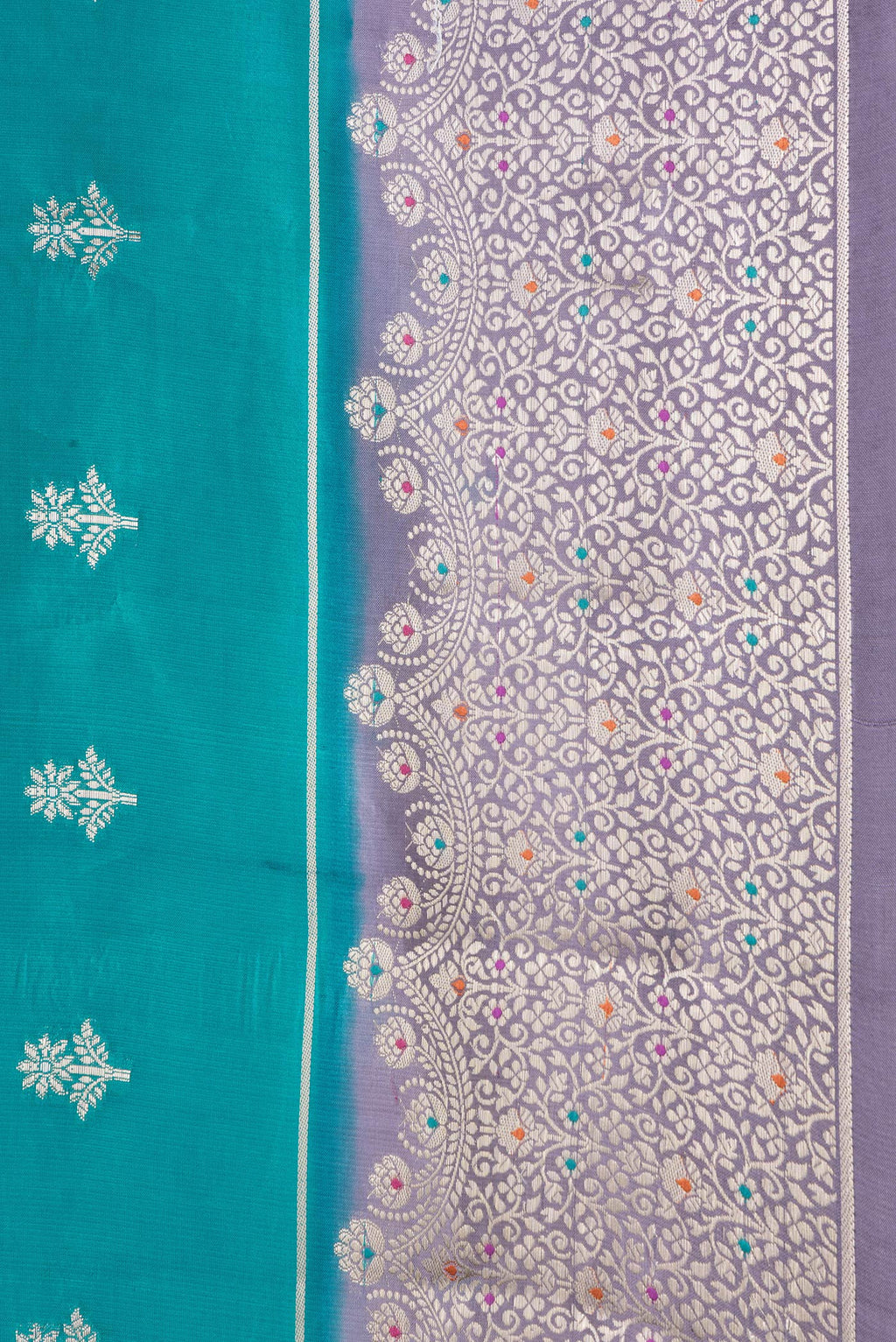 Border image of Peacock Blue Dual Tone Tussar Silk Saree with Zari Butta on the body and Zari Border. 