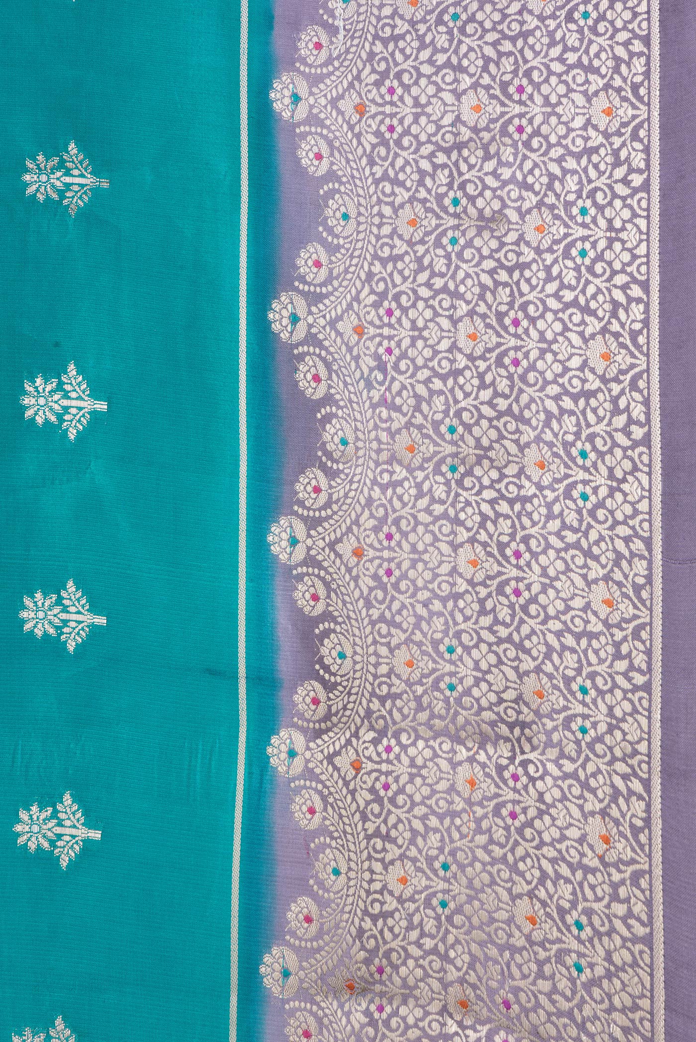 Border image of Peacock Blue Dual Tone Tussar Silk Saree with Zari Butta on the body and Zari Border. 