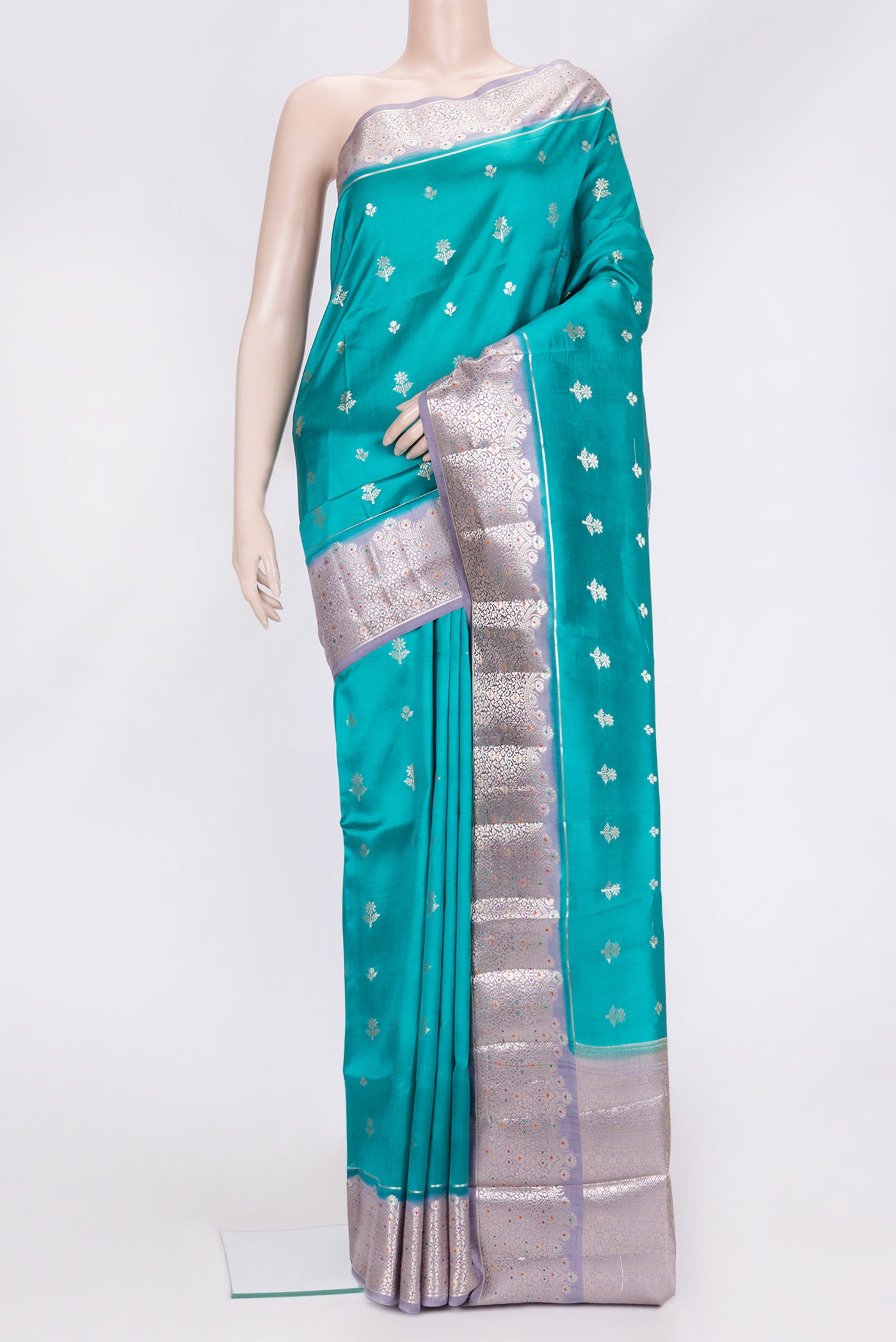Peacock Blue Dual Tone Tussar Silk Saree with Zari Butta on the body and Zari Border.  displayed on a mannequin