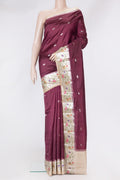 Maroon Tussar Silk Saree with Zari And Thread Butta on the body and Zari Border.  displayed on a mannequin