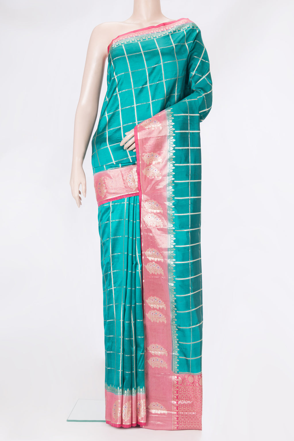 Peacock Blue Tussar Silk Saree with Checked design on the body and Zari Border.  displayed on a mannequin