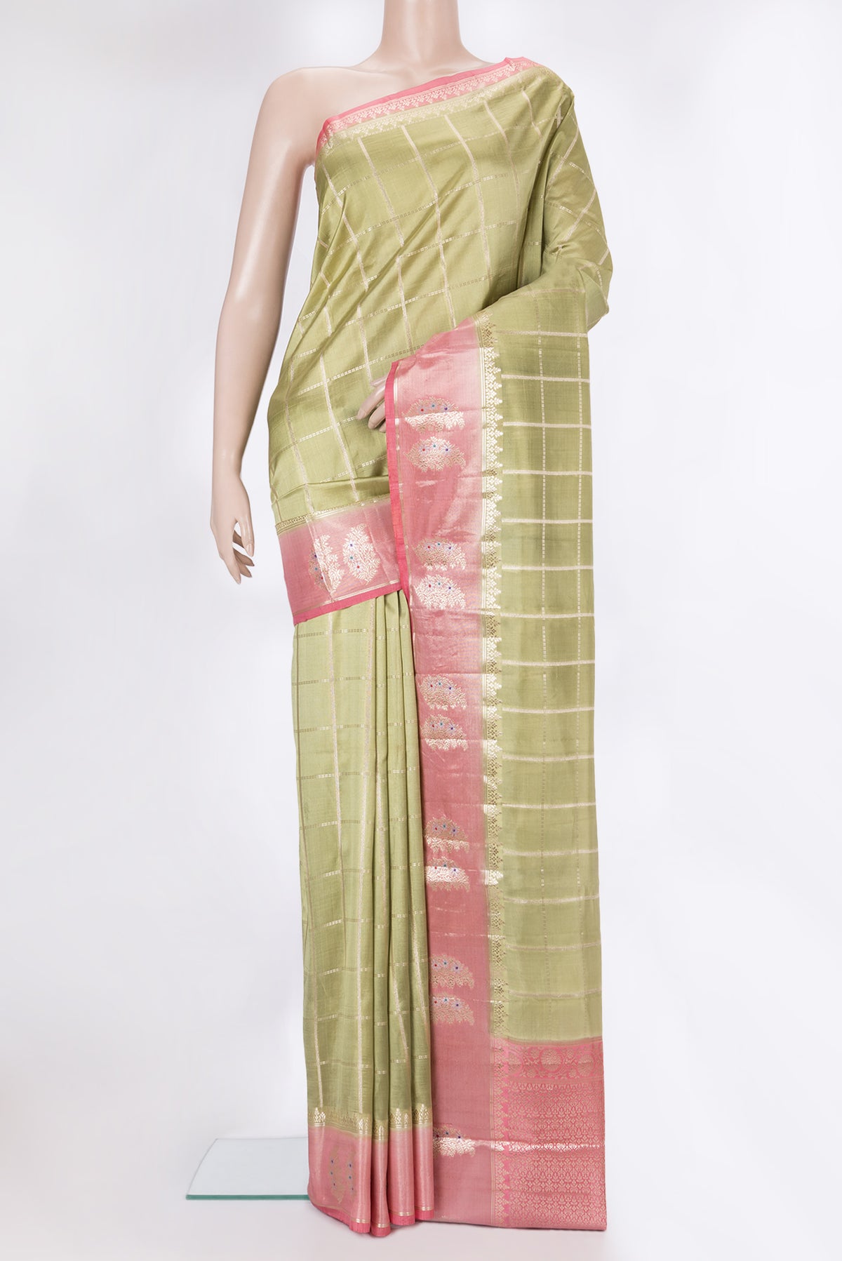 Pure Silk Pista Green Dual Tone Tussar Saree with Checked design on the body and Fancy Border.  displayed on a mannequin