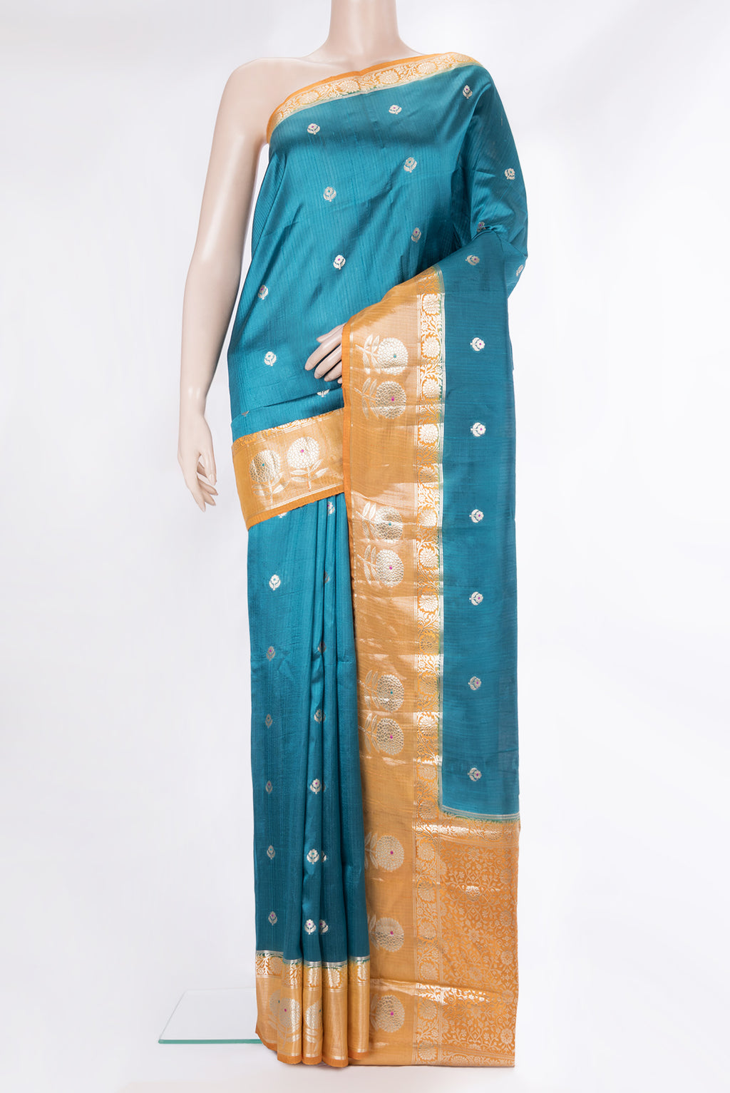 Pure Silk Peacock Blue Dual Tone Tussar Saree with Zari Butta on the body and Fancy Border.  displayed on a mannequin