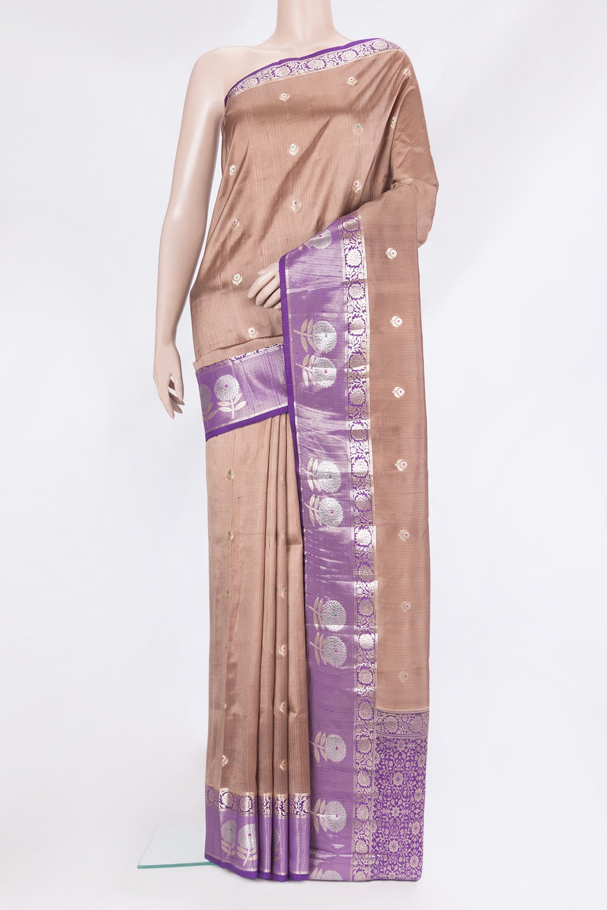 Brown Tussar Silk Saree with Zari Butta on the body and Fancy Border.  displayed on a mannequin