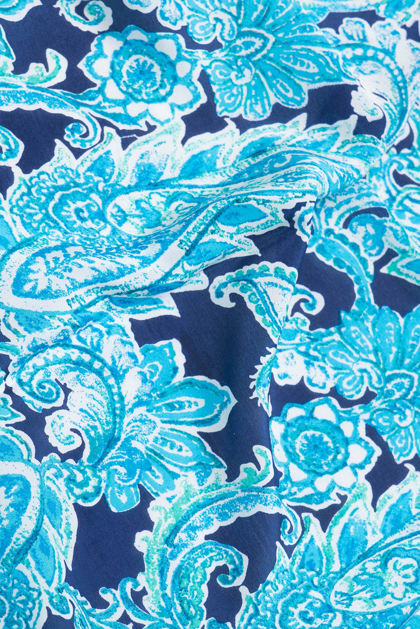 Close up of Navy Blue Dual Tone Crepe Saree with Printed design on the body and Without Border.  displaying folds