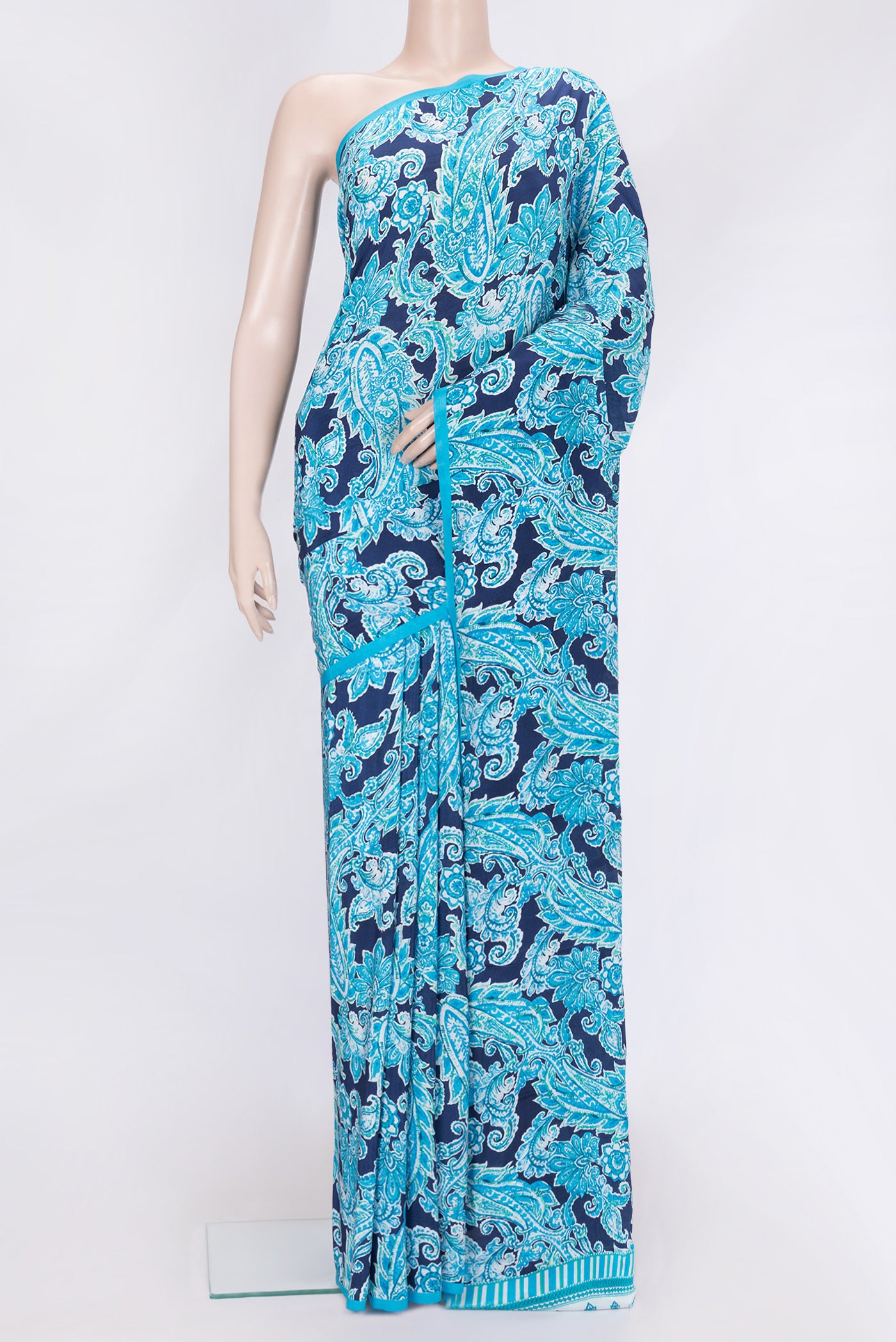 Navy Blue Dual Tone Crepe Saree with Printed design on the body and Without Border.  displayed on a mannequin