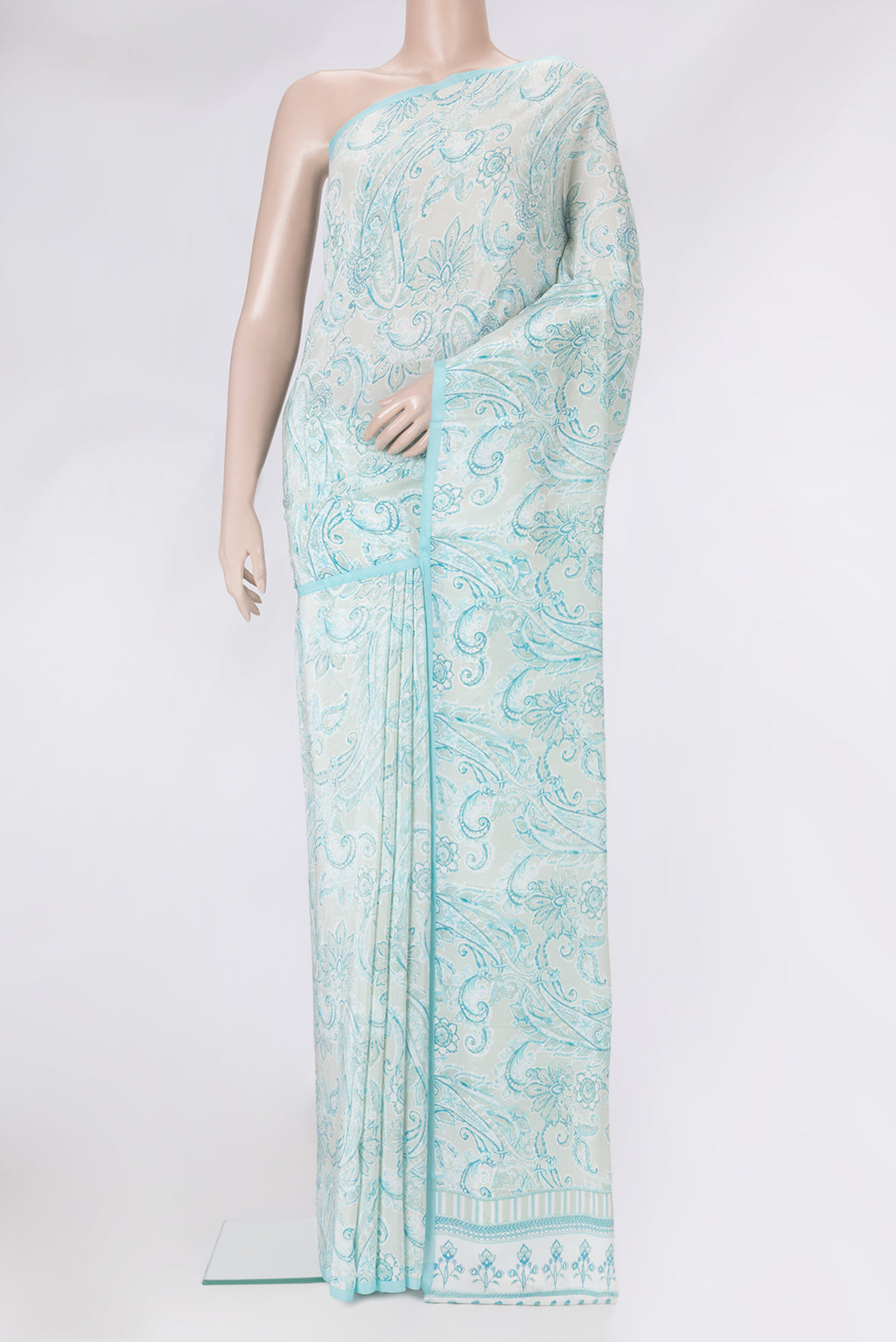 Pista Green Dual Tone Crepe Saree with Printed design on the body and Plain Border.  displayed on a mannequin