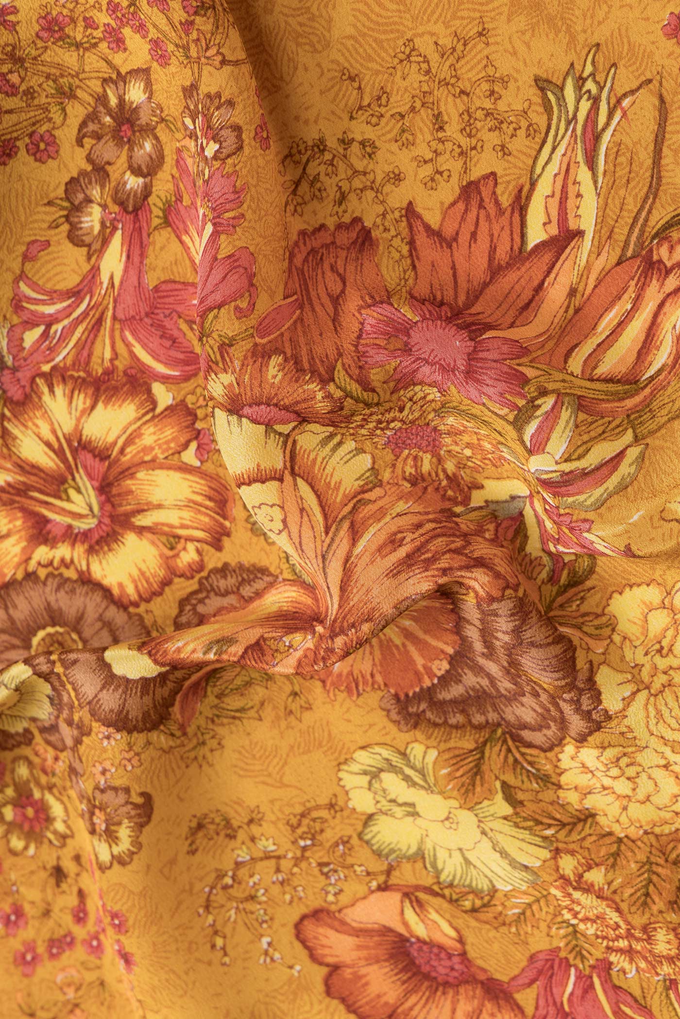 Close up of Mustard Dual Tone Mysore Crepe Saree with Printed design on the body and Plain Border.  displaying folds