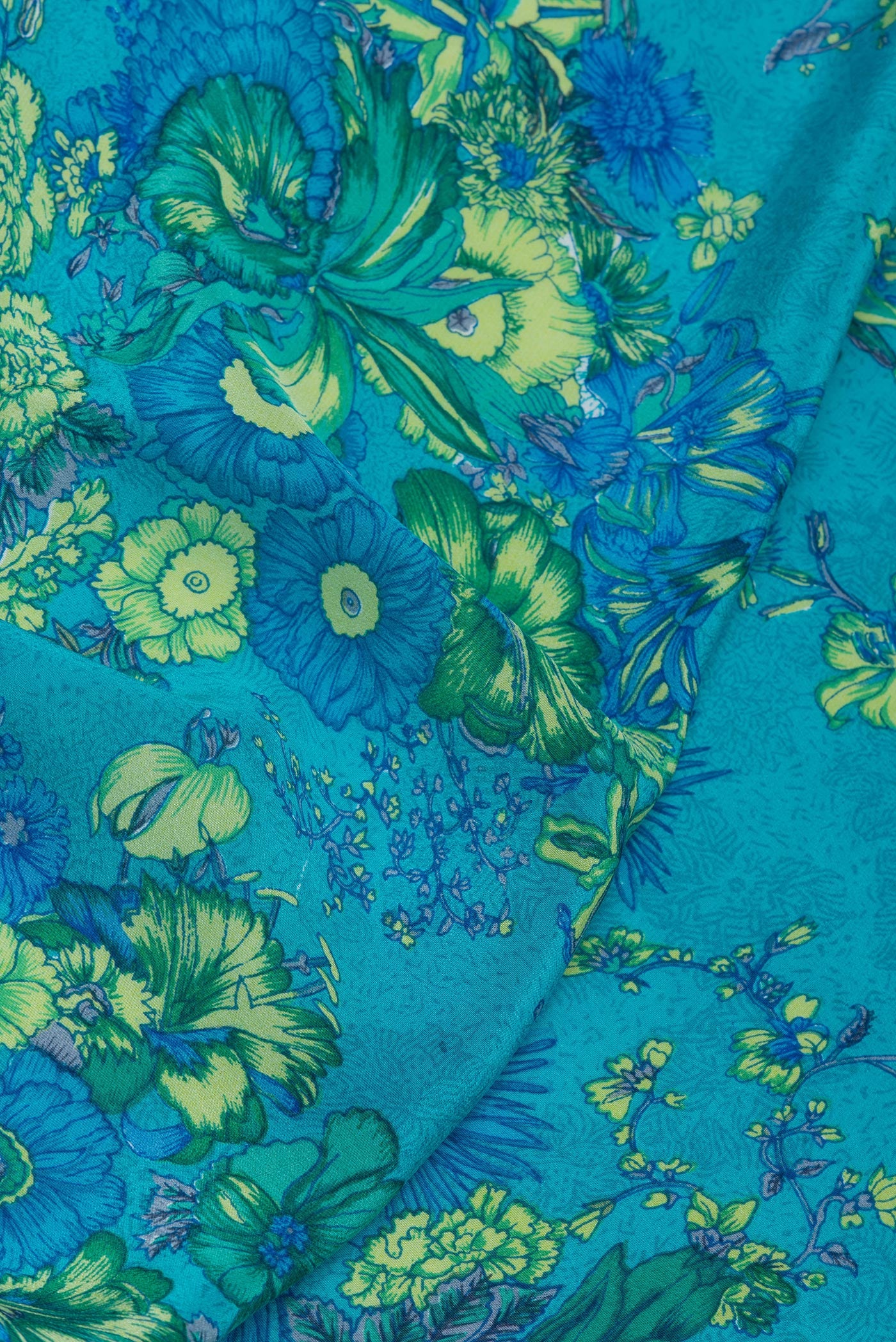 Close up of Sky Blue Crepe Saree with Printed design on the body and Plain Border.  displaying folds