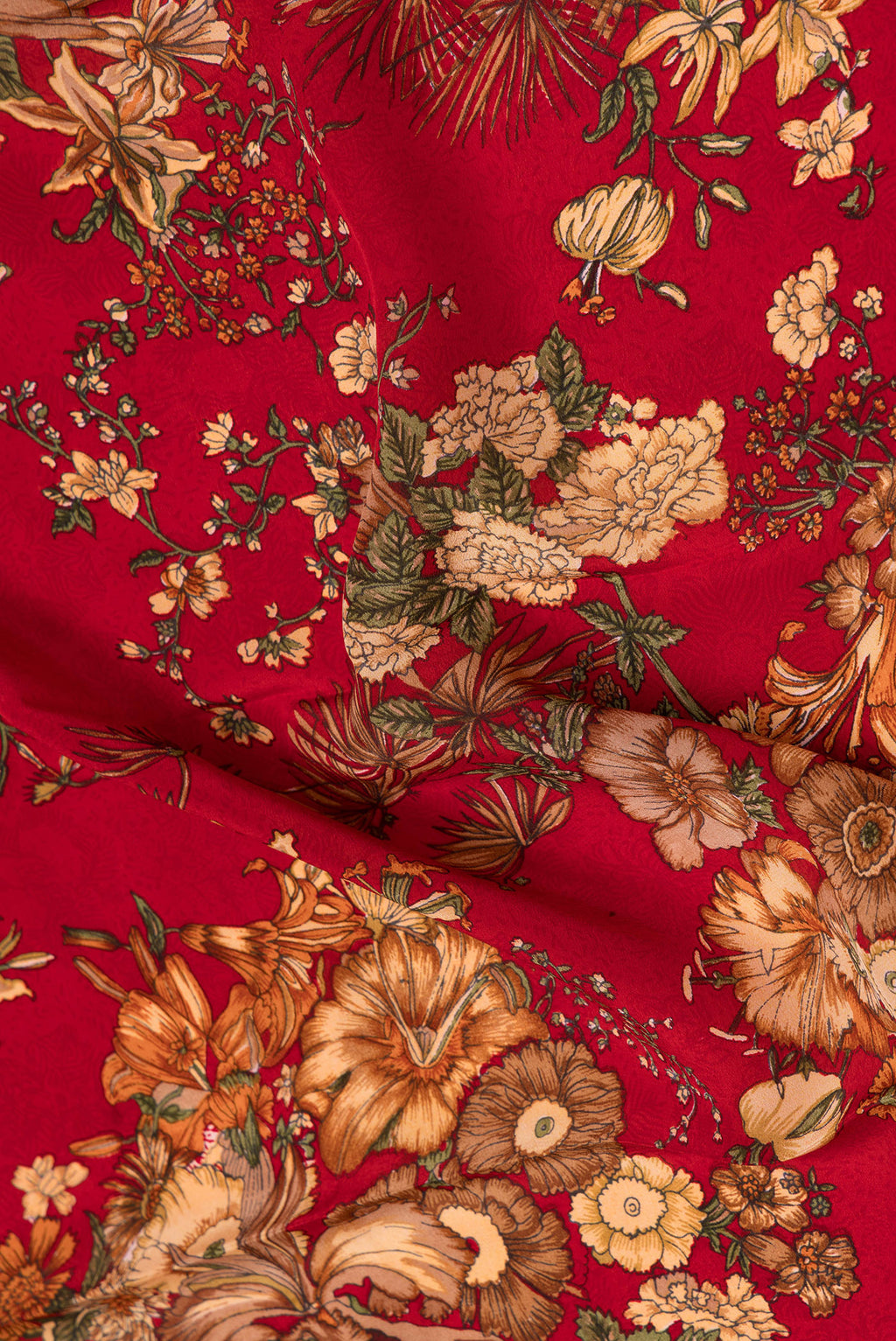 Close up of Red Dual Tone Mysore Crepe Saree with Printed design on the body and Plain Border.  displaying folds