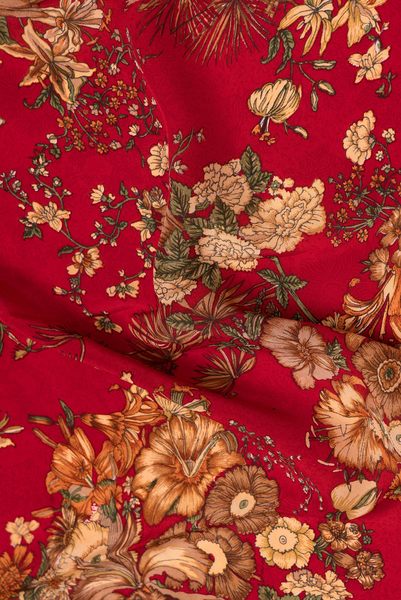 Close up of Red Dual Tone Mysore Crepe Saree with Printed design on the body and Plain Border.  displaying folds