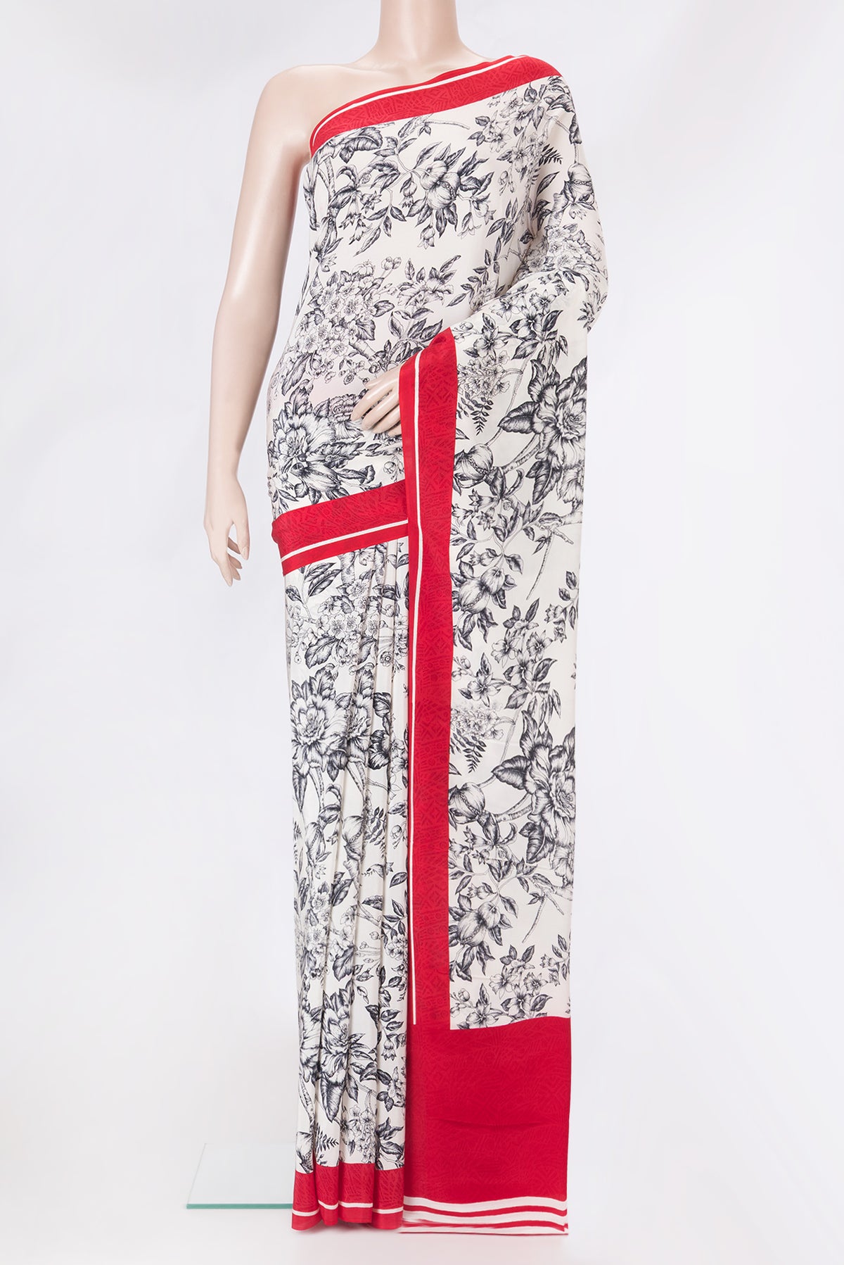 Off White Dual Tone Crepe Saree with Printed design on the body and Printed Border.  displayed on a mannequin