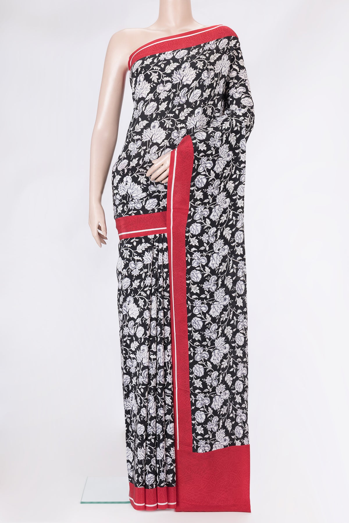 Black Dual Tone Crepe Saree with Printed design on the body and Printed Border.  displayed on a mannequin