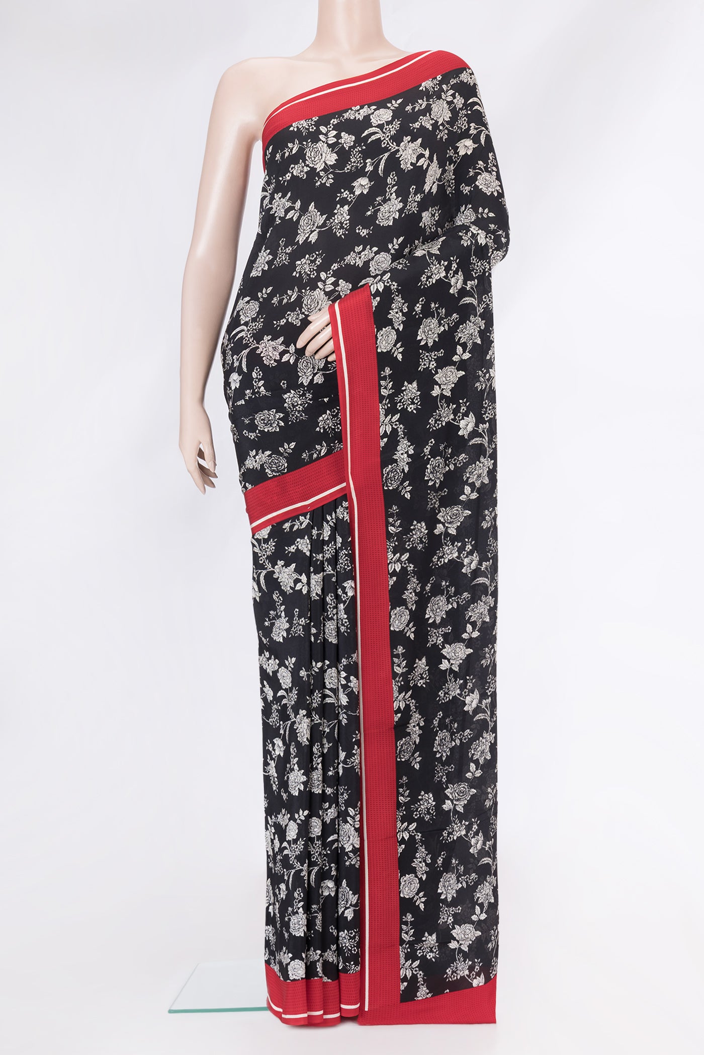 Black Dual Tone Mysore Crepe Saree with Printed design on the body and Plain Border.  displayed on a mannequin