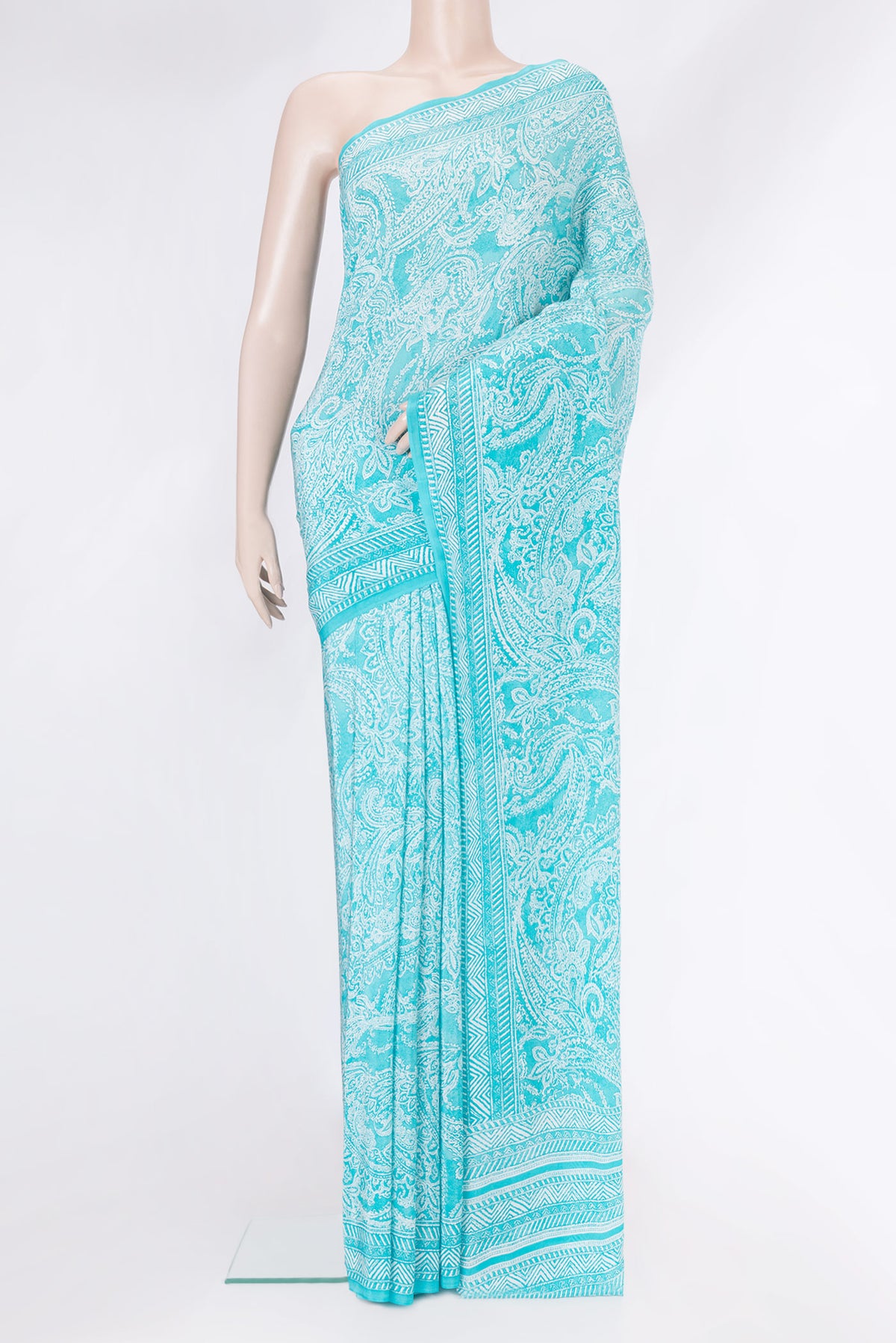 Sky Blue Dual Tone Mysore Crepe Saree with Printed design on the body and Plain Border.  displayed on a mannequin