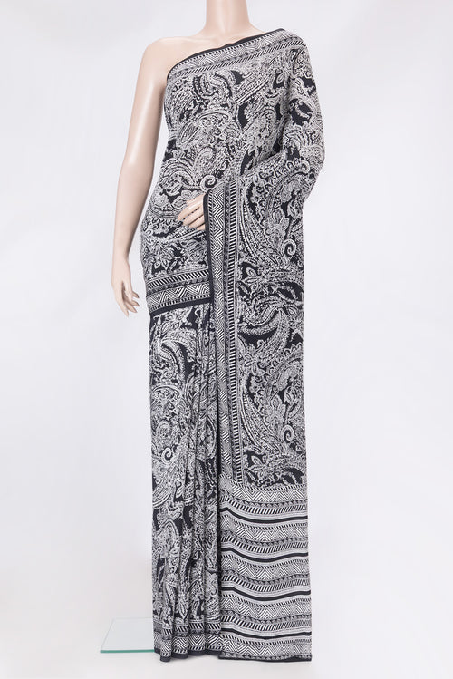 Black Crepe Saree with Printed design on the body and Printed Border.  displayed on a mannequin