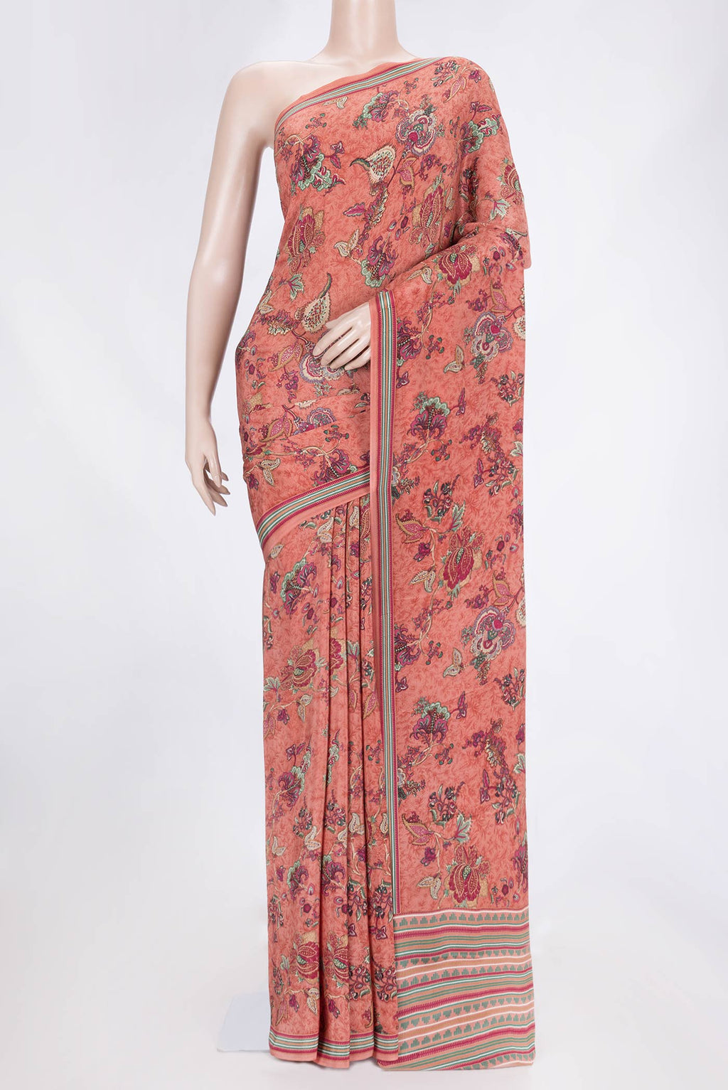 Peach Dual Tone Mysore Crepe Saree with Printed design on the body and Printed Border.  displayed on a mannequin