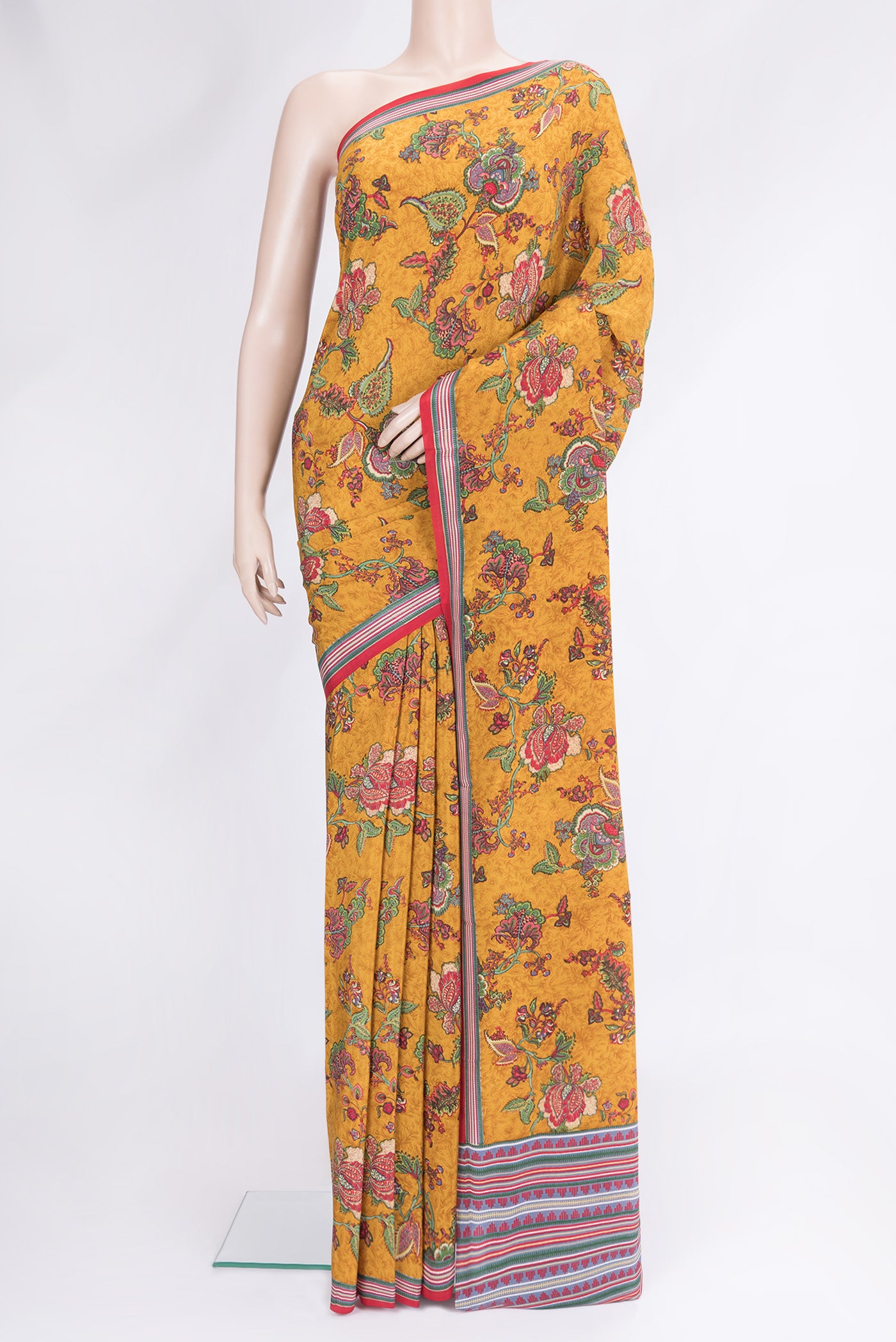 Mustard Dual Tone Mysore Crepe Saree with Printed design on the body and Printed Border.  displayed on a mannequin