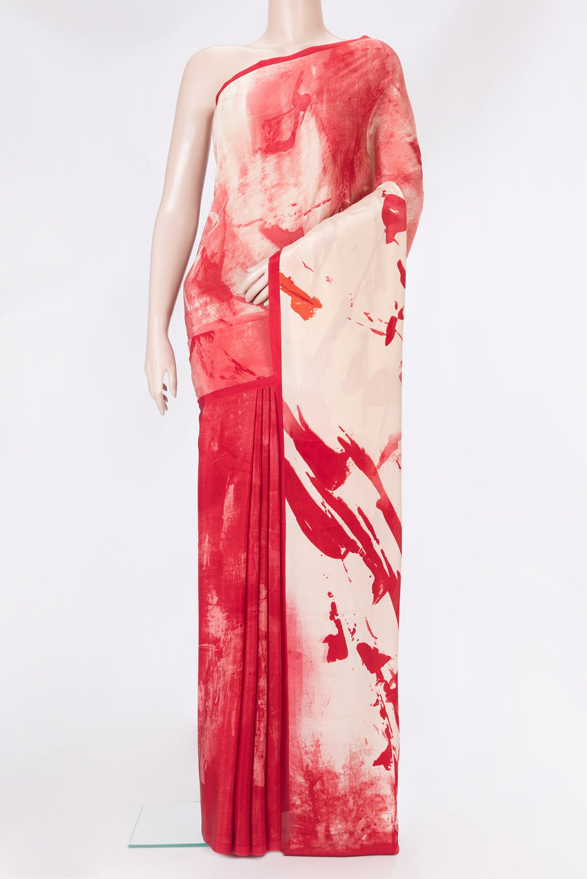 Red Crepe Saree with Printed design on the body and Plain Border.  displayed on a mannequin